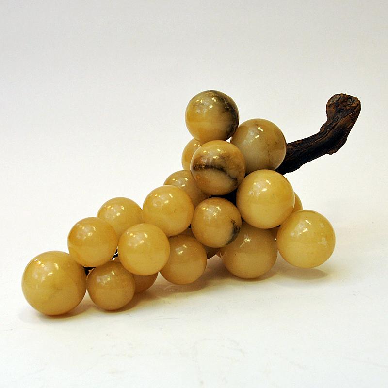 A bunch of Grapes! Realistic and handmade alabaster grape cluster on a real tree branch which looks like real grapes. From Italy in the 1950s. Glaced finish with silky surface. Lovely realistic yellow beige grape color. Looks fantastic on the dining