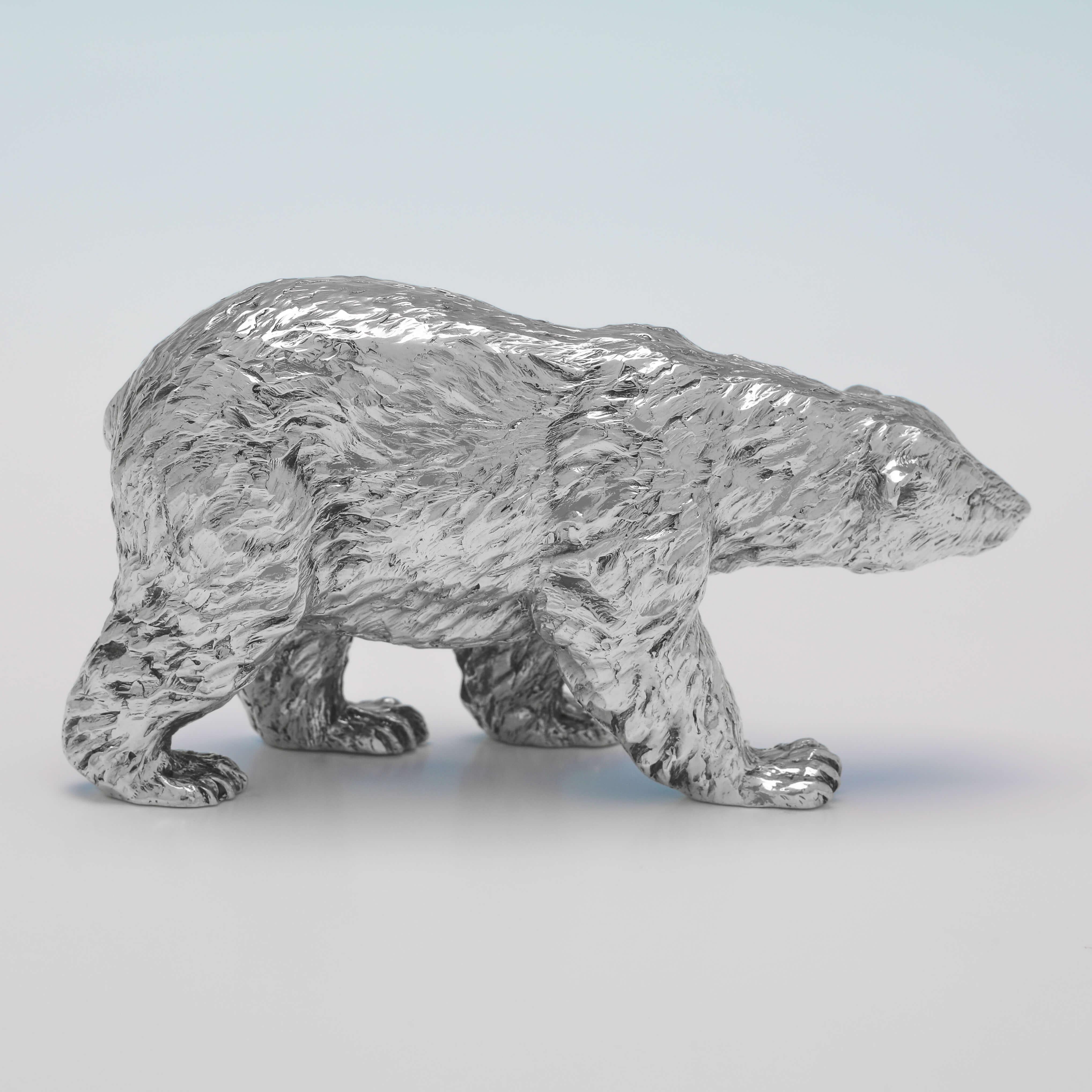 Hallmarked in London in 2013 by BSE Products, this Sterling Silver Model of a Polar Bear, is realistically cast. The polar bear measures 2