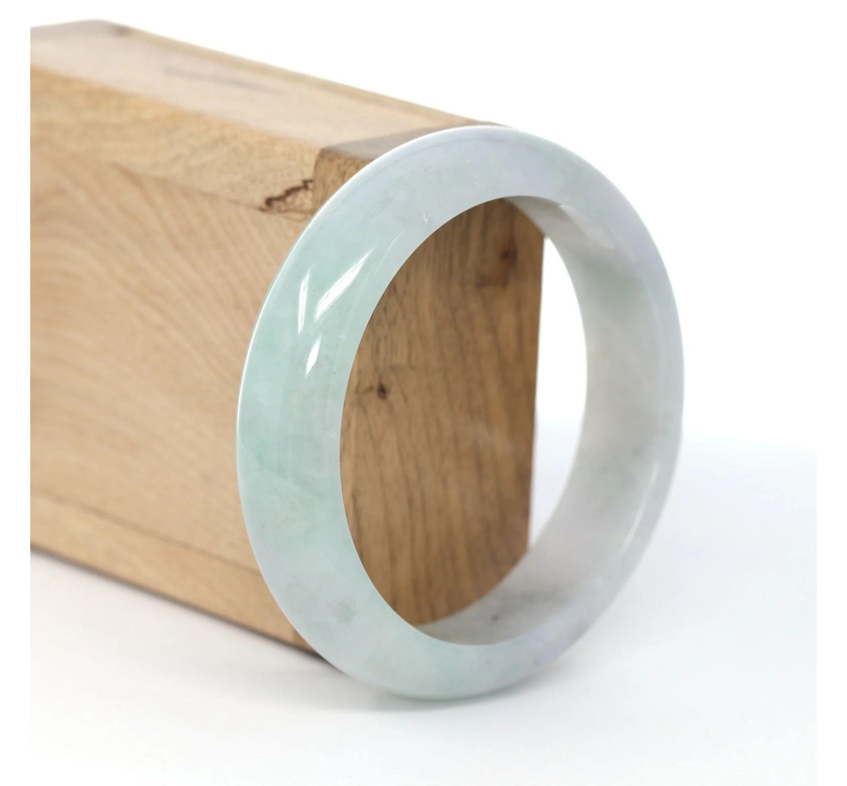 * DETAILS--- This bangle is made with ice light lavender green Burmese jadeite jade. The texture is very smooth and clean even throughout the bangle, very beautifully translucent. This bangle is characterized by beautiful lavender patches. and it's