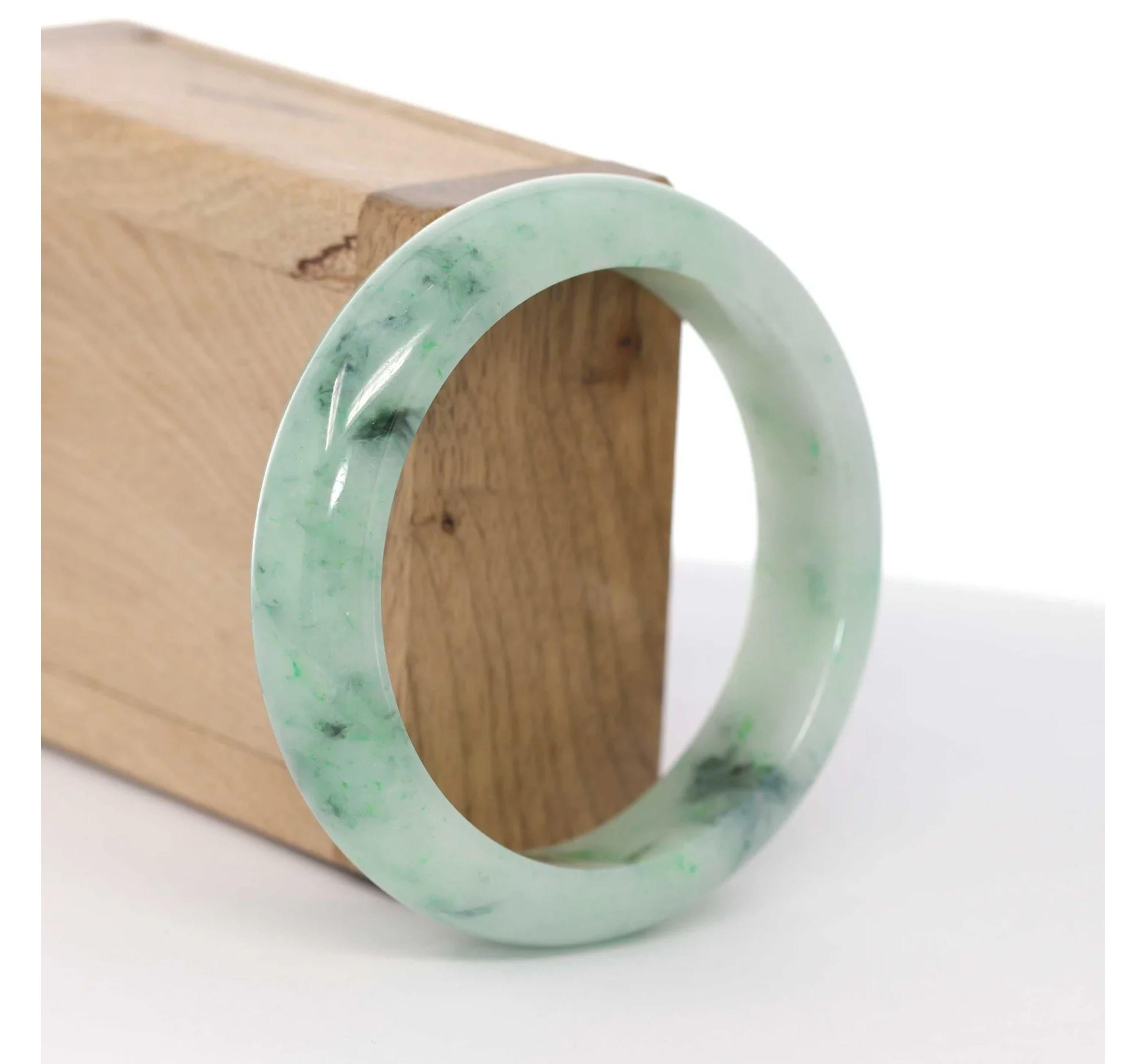 * INTRODUCTION--- Genuine Burmese Jadeite Jade Bangle Bracelet. This bangle is made with very high-quality genuine Burmese Jadeite jade; The jade texture is very smooth and translucent with green and dark green colors inside. This whole bangle is a