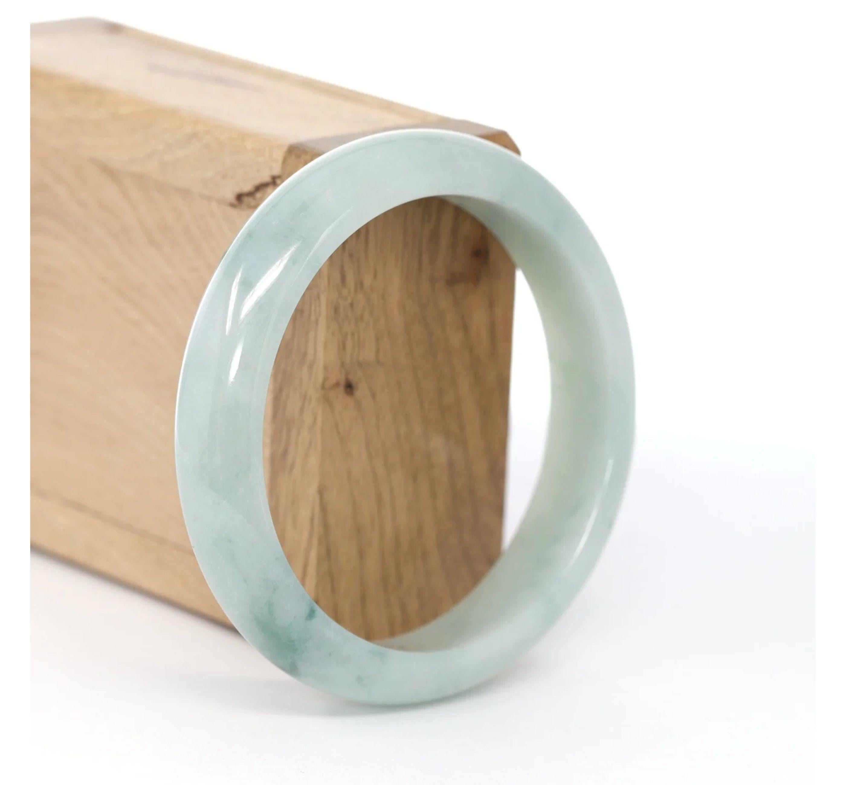 * DETAILS--- This Natural Burmese Jadeite Jade bangle is a beautiful ice blue-green bangle. The texture is very smooth and clean even throughout the bangle, very beautifully translucent under the light. This bangle is characterized by beautiful