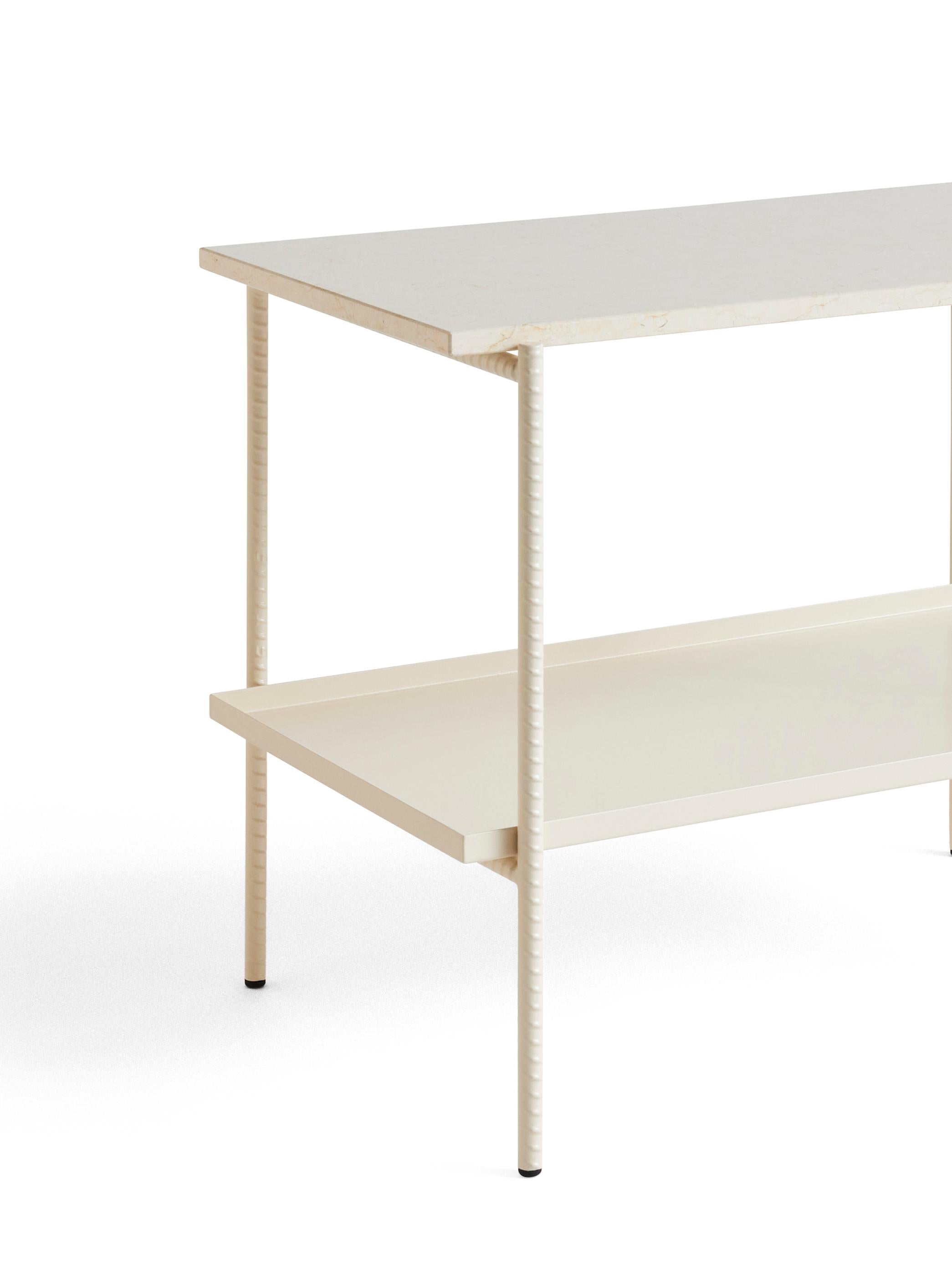Sylvain Willenz’s Rebar tray table having a design that juxtaposes the reinforced steel bar frame with black marble tops and metal trays to create a balanced aesthetic. The table is suitable for using in private, corporate or public