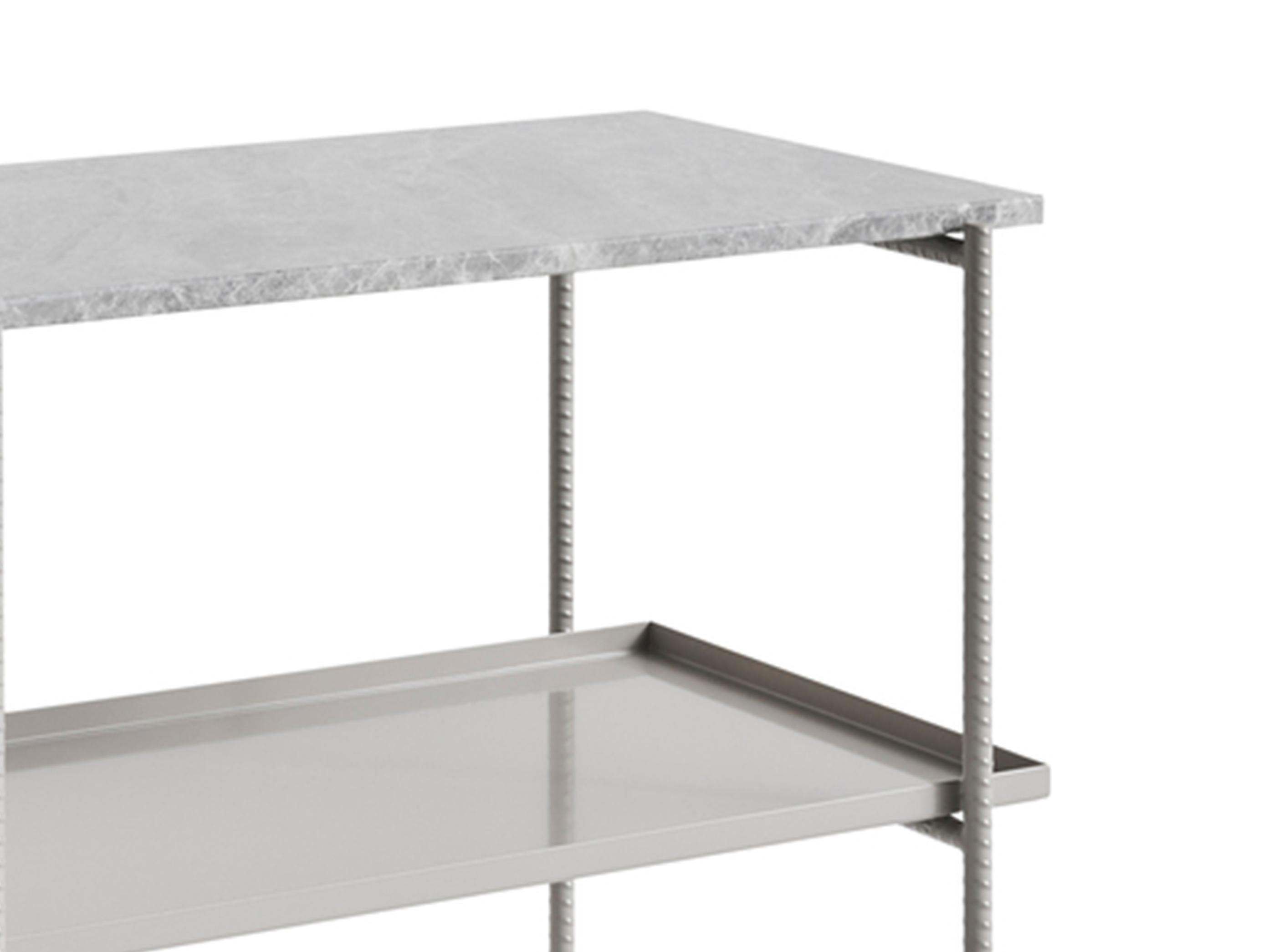 Sylvain Willenz’s Rebar tray table having a design that juxtaposes the reinforced steel bar frame with black marble tops and metal trays to create a balanced aesthetic. The table is suitable for using in private, corporate or public