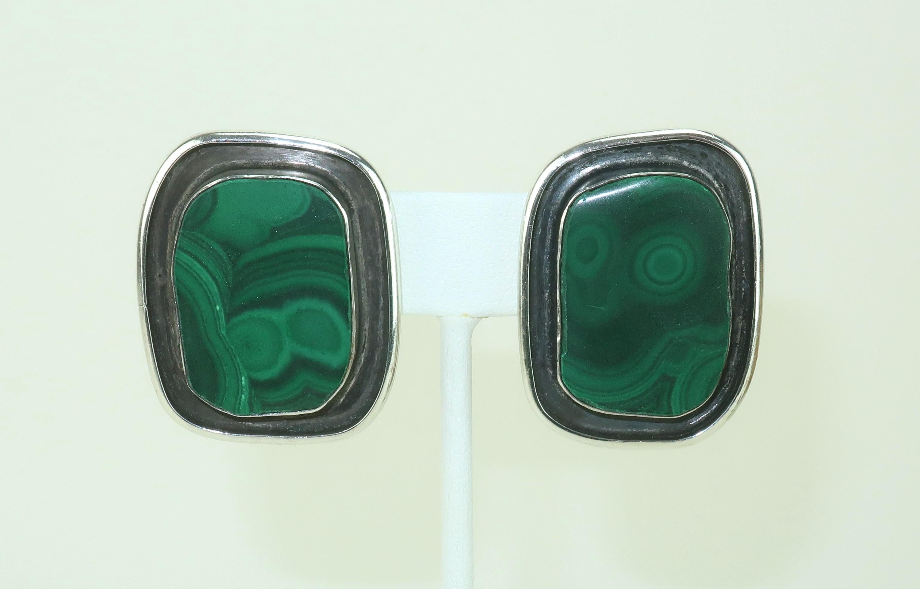 'Bless Our Earth' ... and with that sentiment, Rebecca Collins created this fabulous pair of artisan earrings incorporating beautiful green malachite stones with sterling silver for an adornment with Mother nature's approval.  The sterling body of
