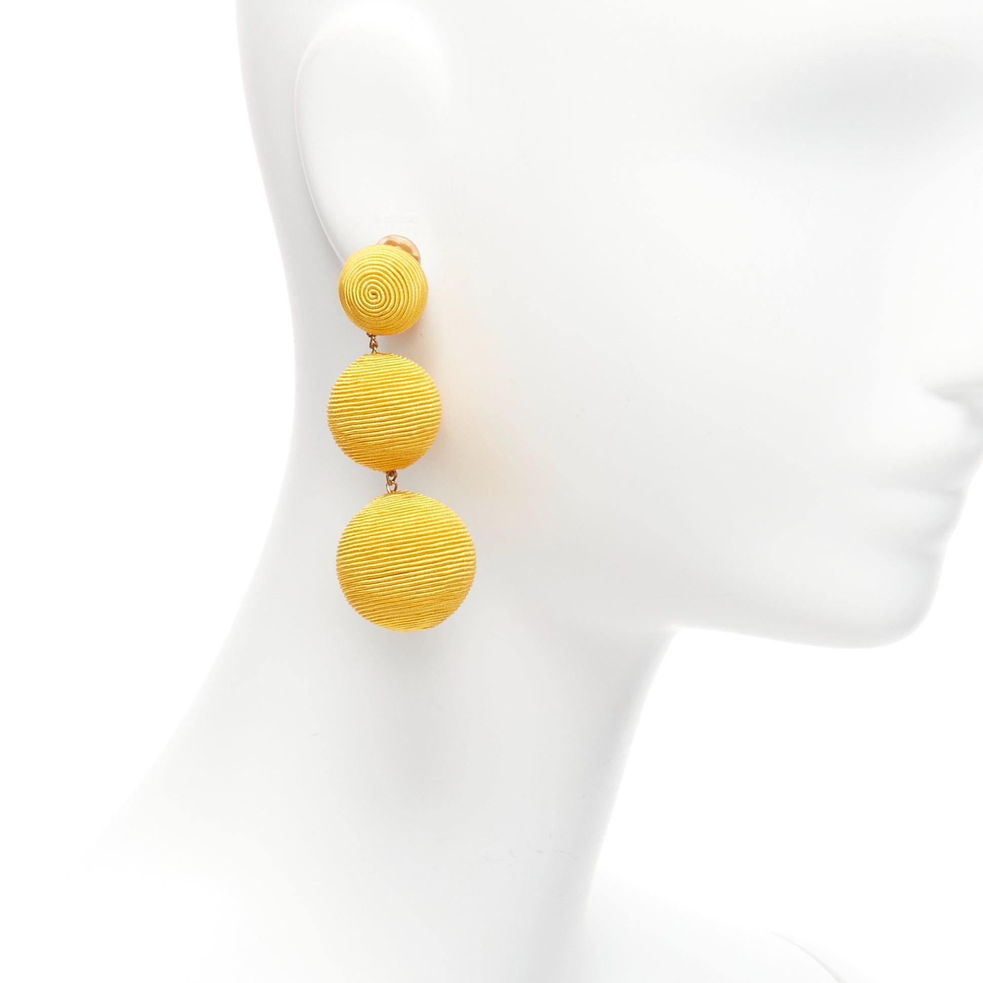 REBECCA DE RAVENEL yellow trio balls dangling clip on earrings Pair
Reference: LNKO/A02208
Brand: Rebecca De Ravenel
Material: Fabric
Color: Yellow
Pattern: Solid
Closure: Clip On
Lining: Gold Metal
Made in: India

CONDITION:
Condition: Excellent,