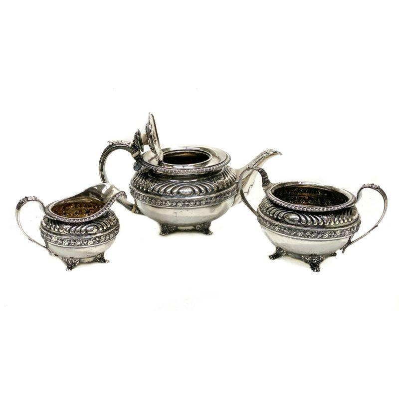 Rebecca Emes & Edward Barnard I London sterling silver 3 piece tea set, 1817

Rebecca Emes & Edward Barnard I London sterling silver 3 piece tea set, 1817. Hand chased leaves and floral trim to the exterior. Ribbed texture to the top rim. A small