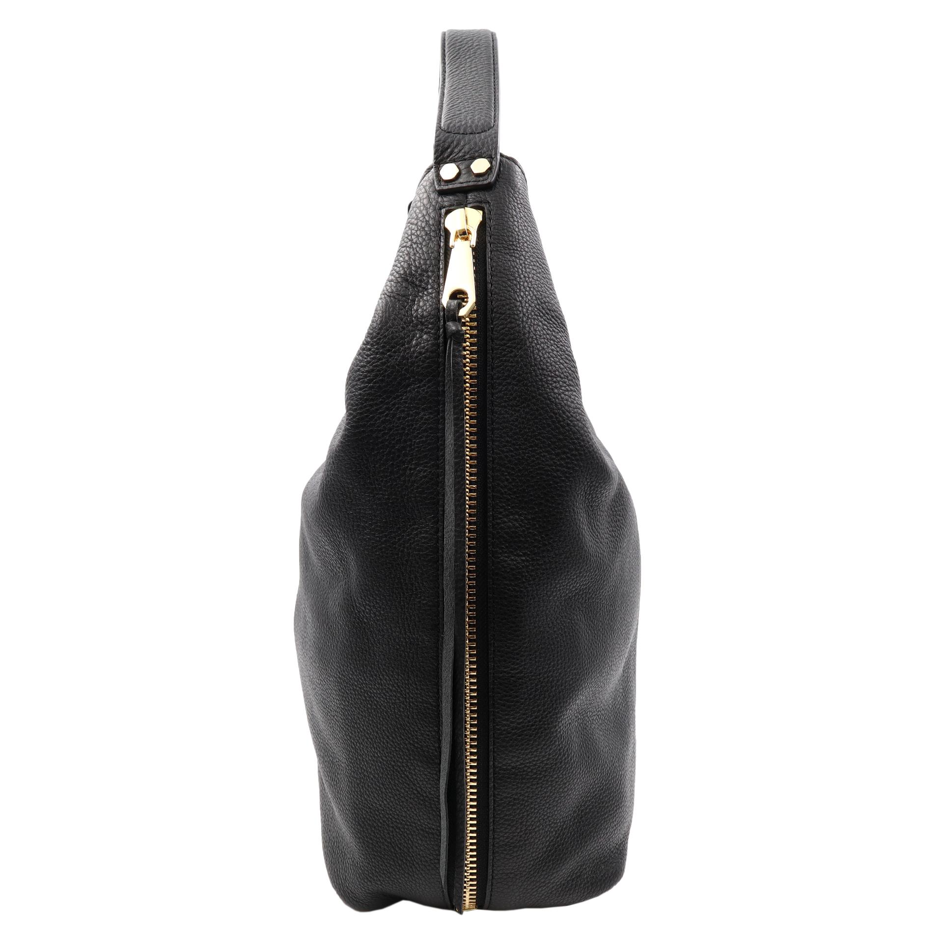 Color/material: black leather
Exterior design details: gold-tone hardware, exterior pockets
Interior design details: fabric lining, interior pockets
Measurements: Length: 16 inch x Height:14 inch x Depth x 3 inch 
Top handle drops 5 inch
Open top