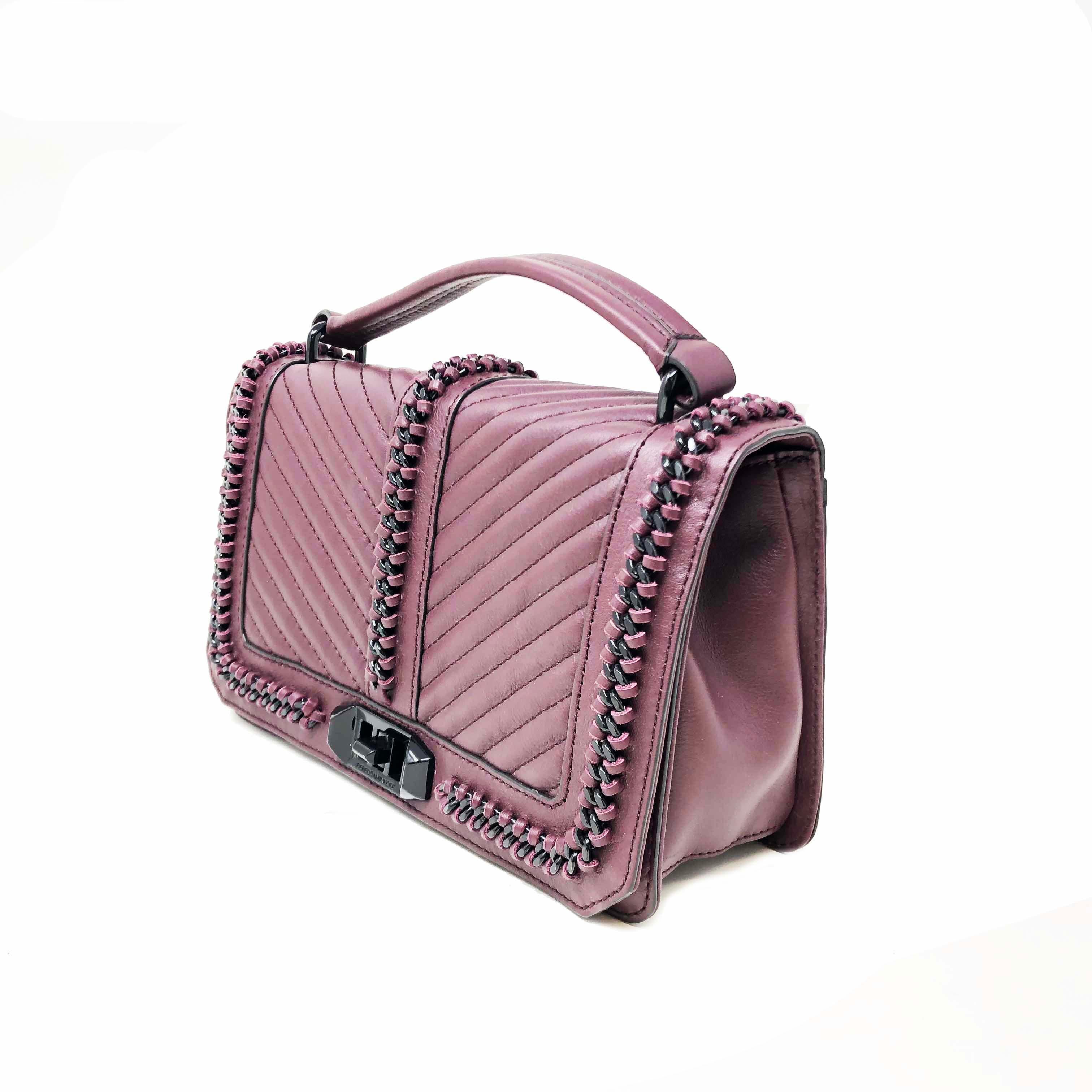 Rebecca Minkoff's It girl-adored crossbody looks tough-luxe with chain link trim and chevron quilting, plus a new top handle silhouette.  Top handle, adjustable chain crossbody strap; Turnlock flap closure; lined; Exterior slip pocket, interior zip