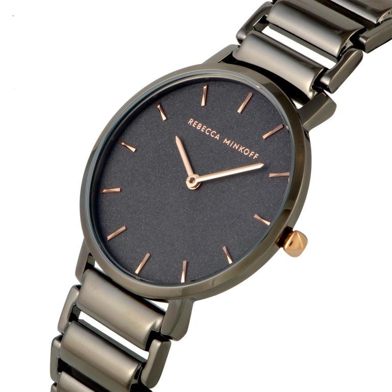 This is the Rebecca Minkoff Major watch, reference number 2200261. It is presented with a gray ion-plated stainless steel case that is mounted onto a matching gray ion-plated stainless steel bracelet. The case measures 35 mm in diameter and is