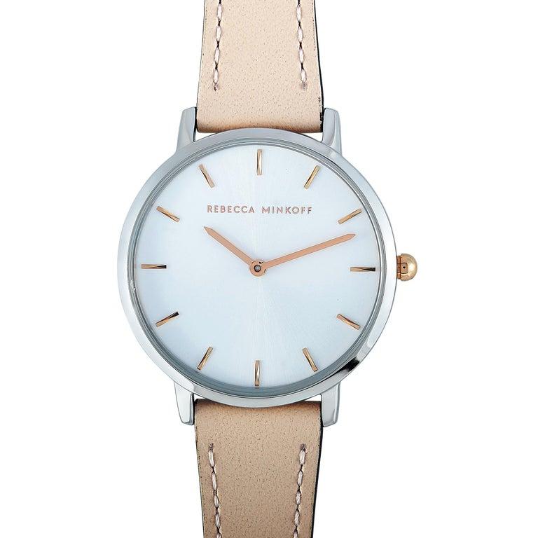 This is the Rebecca Minkoff Major watch, reference number 2200342. It boasts a 35 mm stainless steel case that is water-resistant to 30 meters. The case is presented on a blush rose leather strap fitted with a tang buckle. This model is equipped