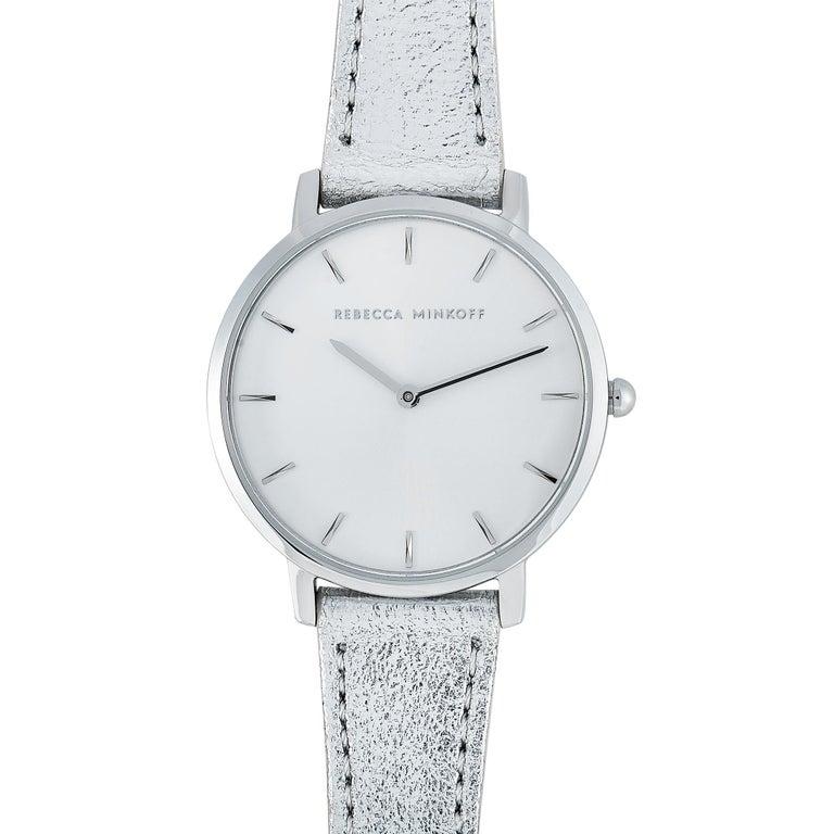 This is the Rebecca Minkoff Major watch, reference number 2200365. It boasts a 35 mm stainless steel case that is water-resistant to 30 meters. The case is presented on a silver leather strap fitted with a tang buckle. This model is equipped with a