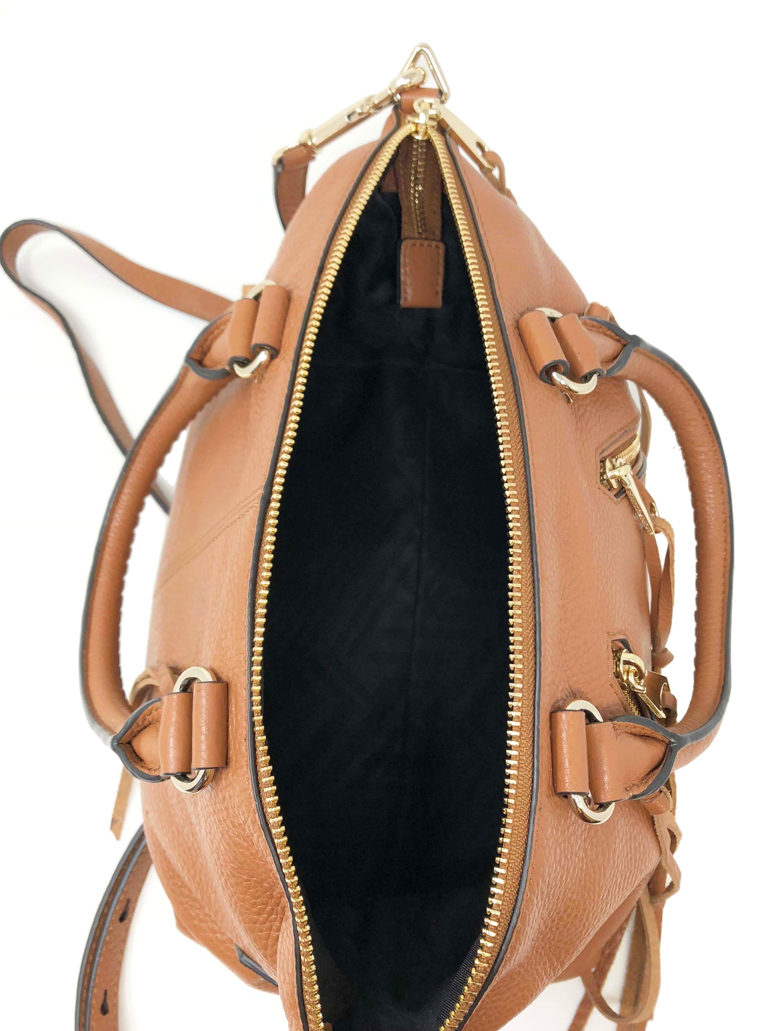 This is new with tags Rebecca Minkoff Moto HF16MOS26 Almond Leather Ladies Satchel Purse. It is crafted from soft pebble leather and finished with gold-tone hardware, this moto satchel is the ideal go-anywhere bag. The purse has 2 exterior zip