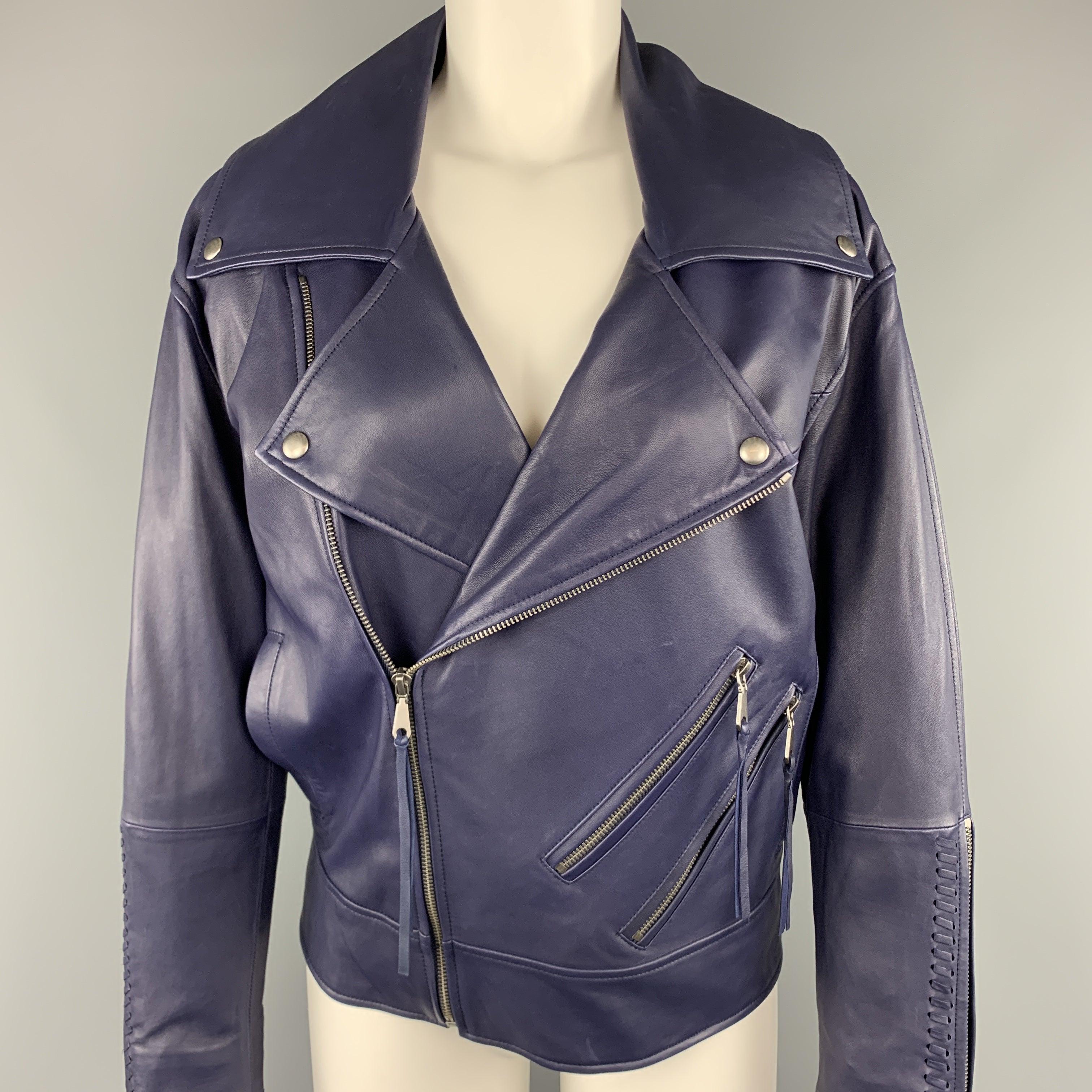 REBECCA MINKOFF biker jacket comes in navy lamb skin leather with a pointed lapel, oversized fit, and whip stitch details.
New With Tags. 

Marked:   XS 

Measurements: 
 
Shoulder: 21 inches Bust:
40 inches Sleeve:
21 inches Length:
24 inches 
  
 