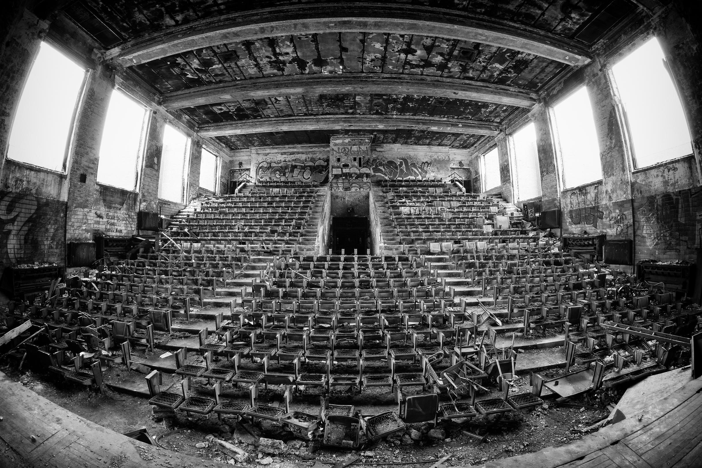 Rebecca Skinner Black and White Photograph - "Burned Out", contemporary, stadium, abandoned, school, black, white, photograph