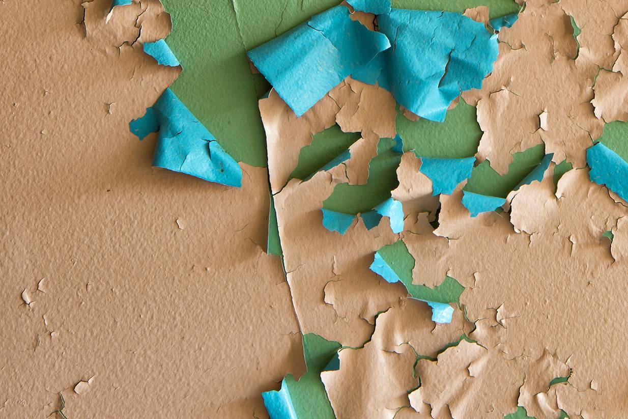 Rebecca Skinner’s “Crumbling” is a 20 x 30 inch abstract metal print. The color photograph is part of her “Transient” series. The peeling paint with colors of green, blue and peach has breathtaking depth and amazing detail. The frameless print has a