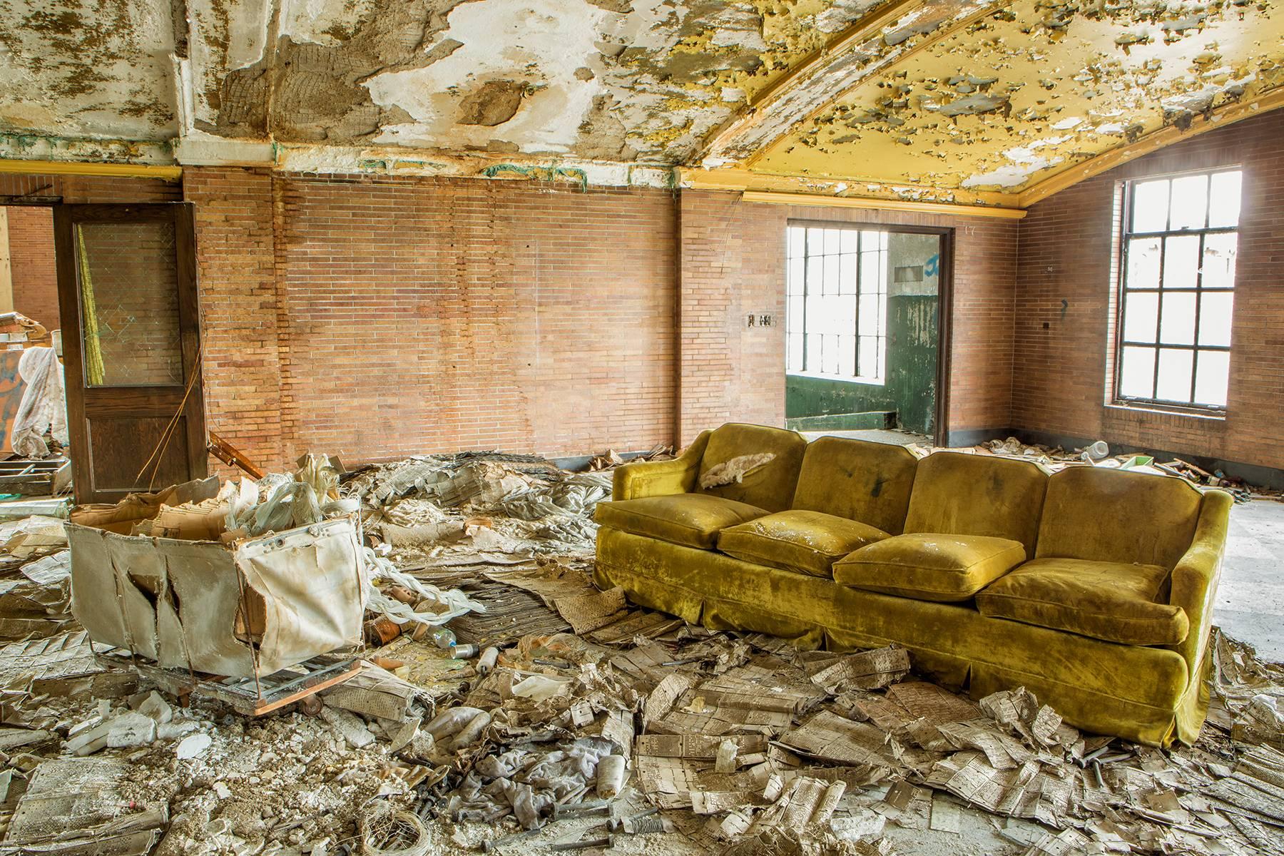 Rebecca Skinner Color Photograph - "Discarded", contemporary, industrial, couch, yellow, color photograph