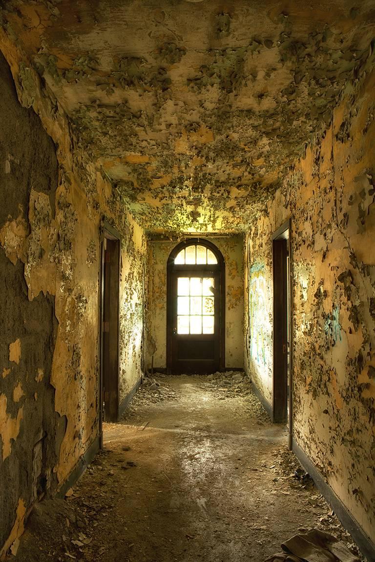 "Passage", contemporary, interior, hallway, abandoned, yellow, color photograph - Photograph by Rebecca Skinner