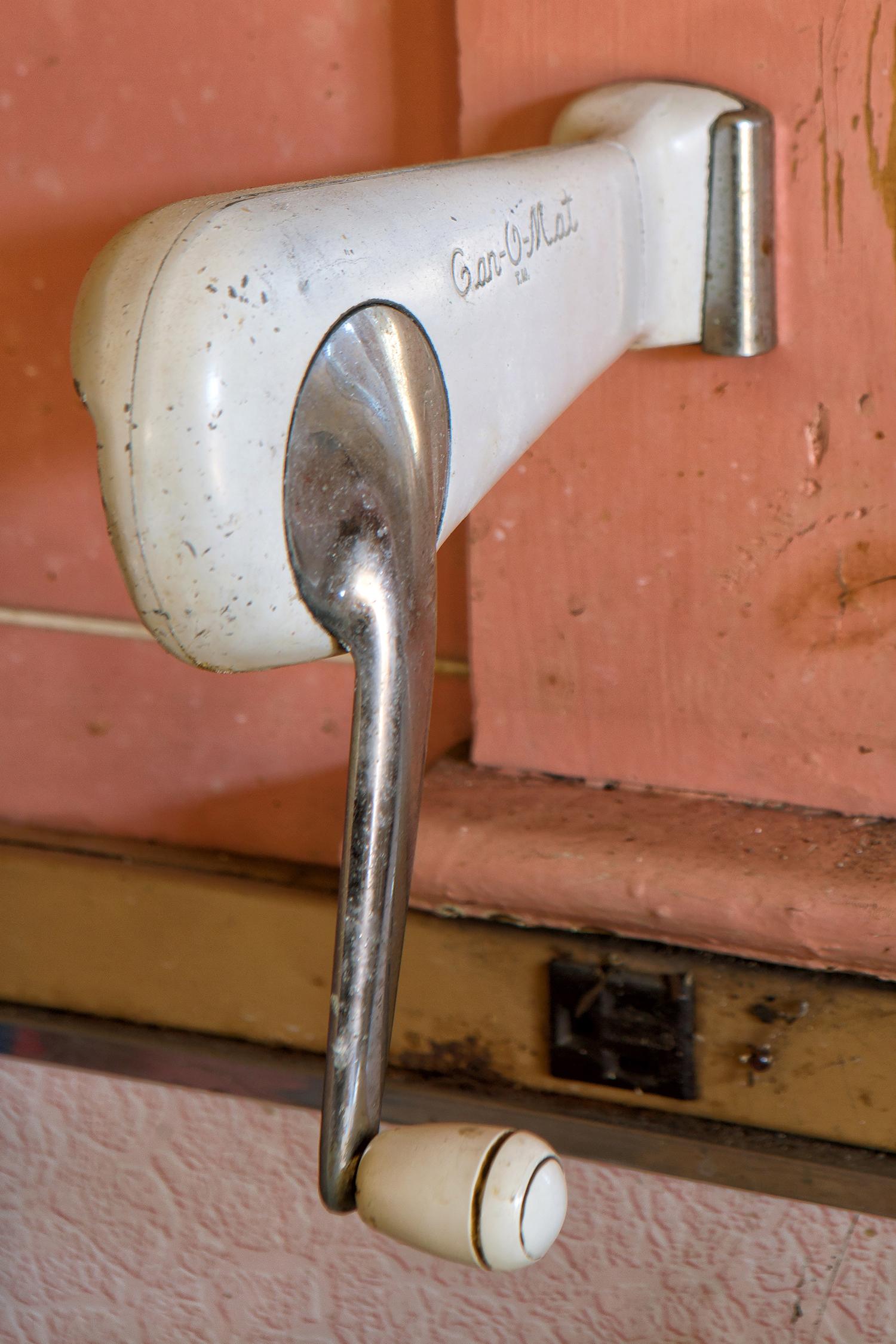 Rebecca Skinner’s “Past” is a 18 x 12 inch metal print and is part of her “Transient” series. The color photograph is of a vintage can opener at an abandoned home. With satin finish, the image is infused directly into metal making it waterproof and