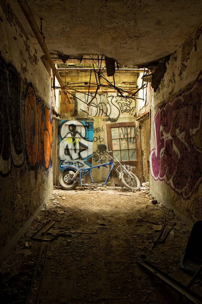 "Ride On", abandoned, motorcycle, graffiti, blue, dark, gritty, color photograph - Photograph by Rebecca Skinner