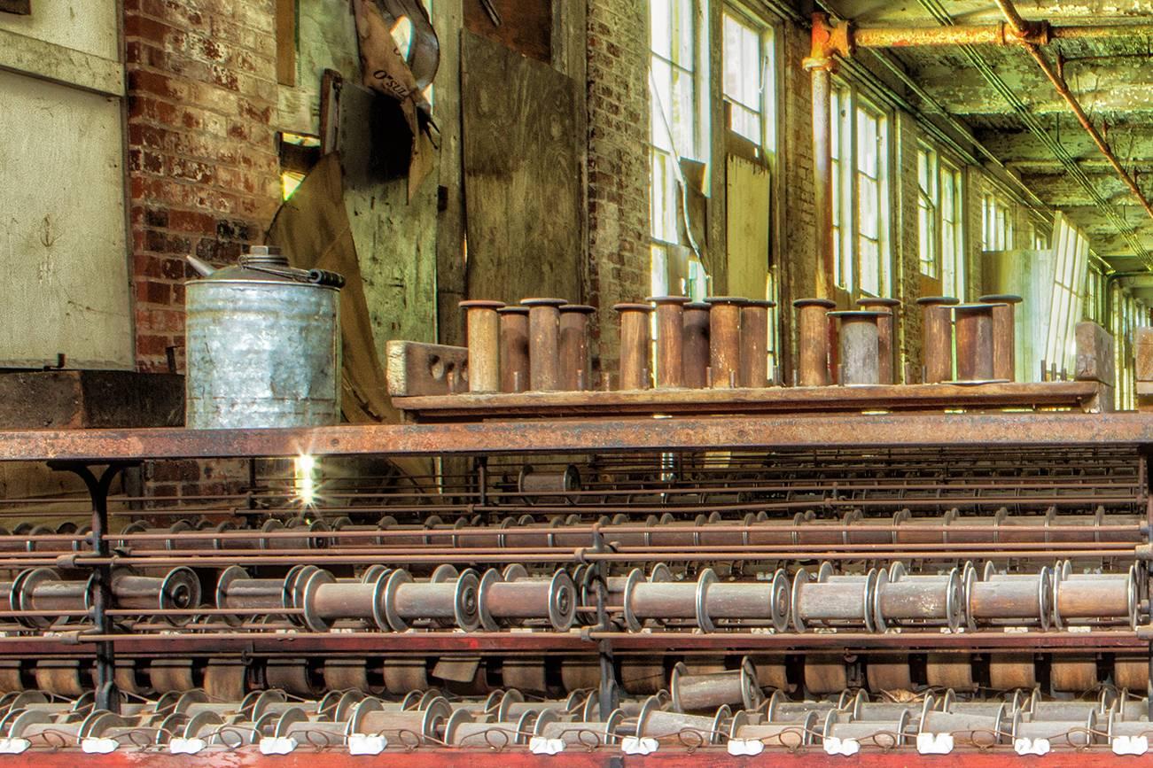 Rebecca Skinner’s “Silk Mill” was photographed at an abandoned mill and is part of a series documenting the loss of industry in America. The 16 x 24 inch color photograph with satin finish is infused directly into metal making it waterproof and easy