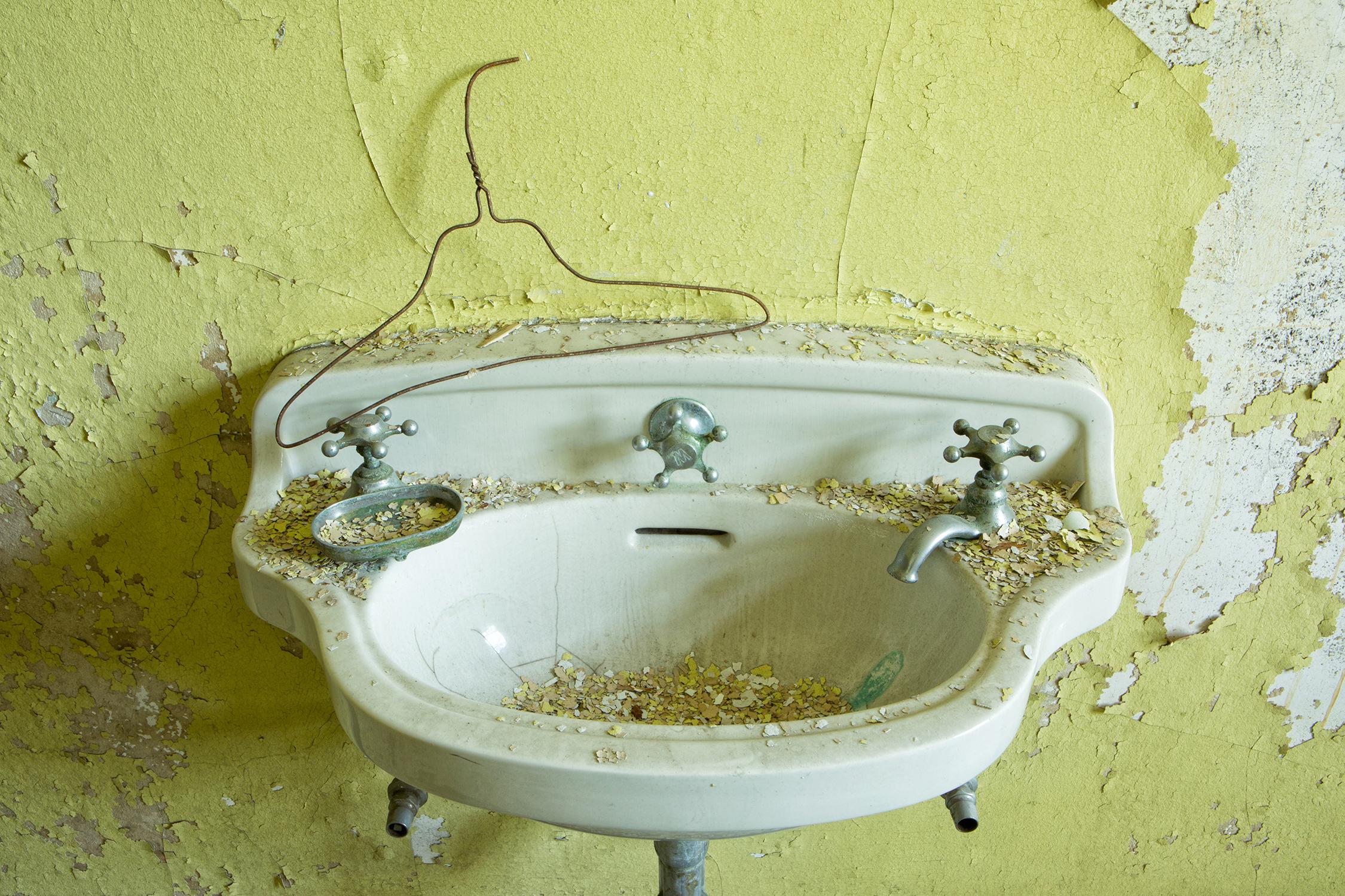 "Sink II", contemporary, abandoned, yellow, green, metal print, color photograph - Photograph by Rebecca Skinner
