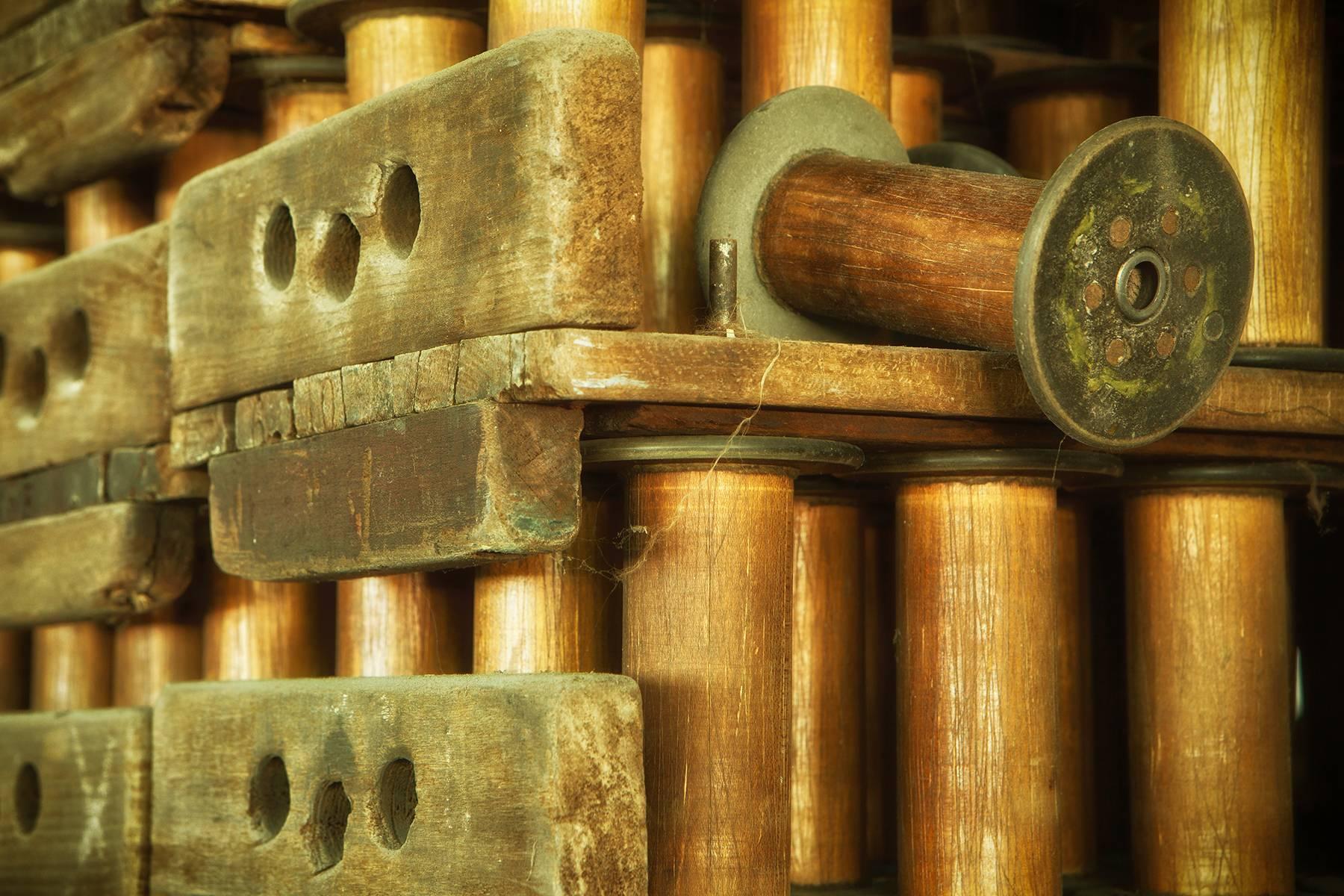 Rebecca Skinner Still-Life Photograph - "Spools", color photograph, abandoned silk mill, industrial, vintage, brown