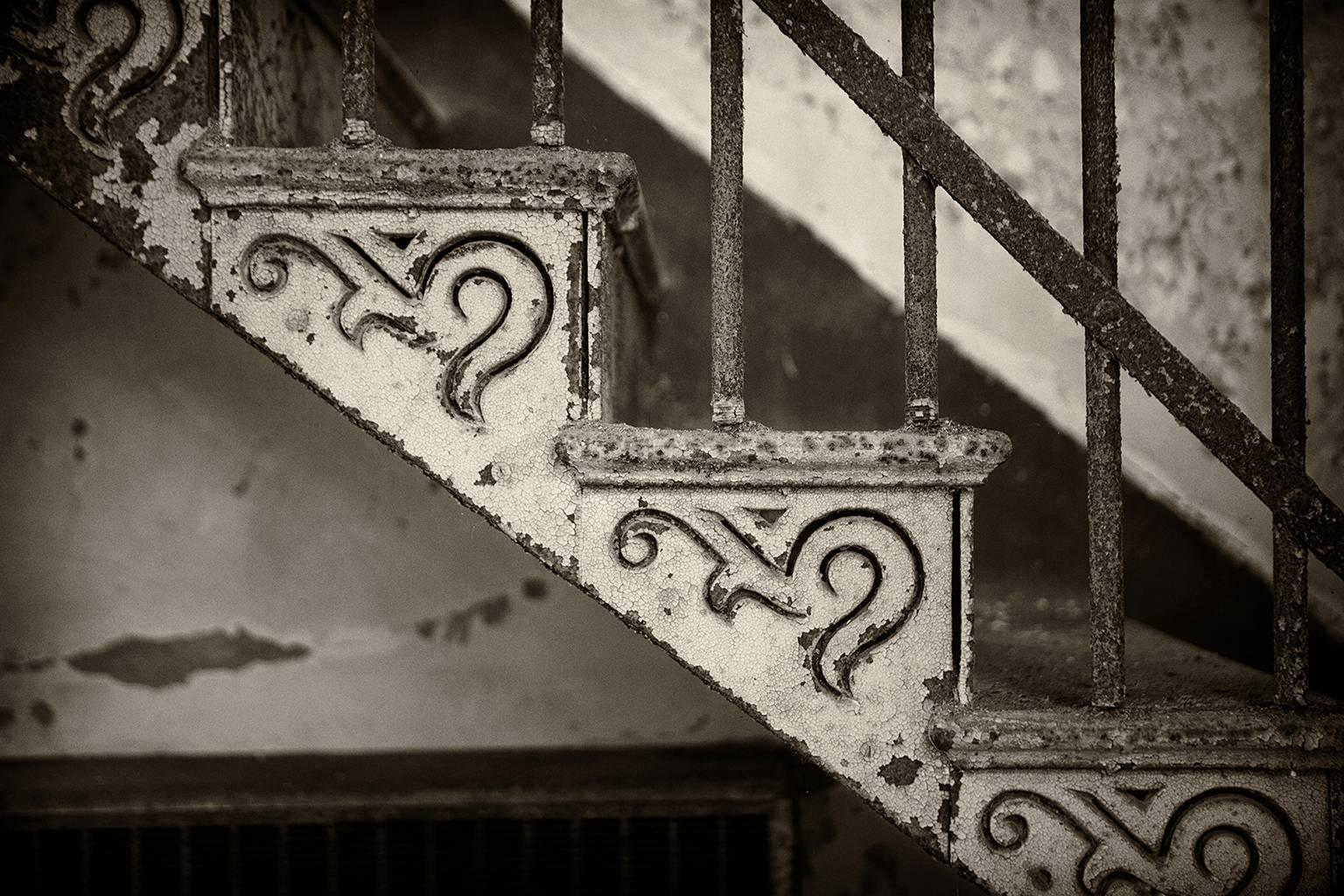 Rebecca Skinner Still-Life Photograph - "Stair Detail", black and white, abandoned, iron, metal print, photography