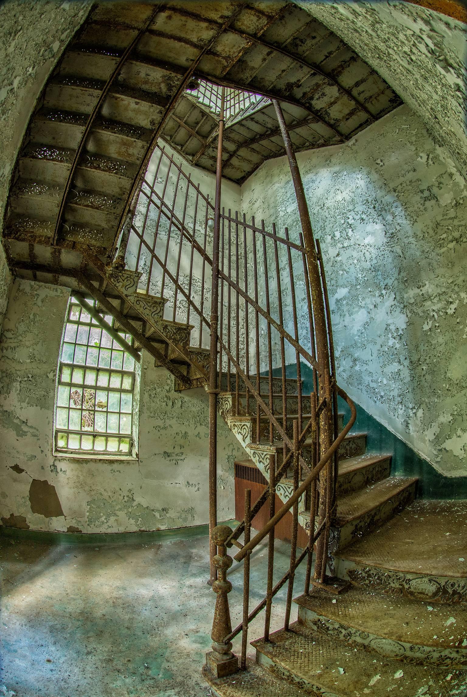 Rebecca Skinner’s “Stairway” was photographed at an abandoned asylum and is part of her “Forgotten” series raising mental health awareness. The 30 x 20 inch color photograph with satin finish is infused directly into metal making it waterproof and