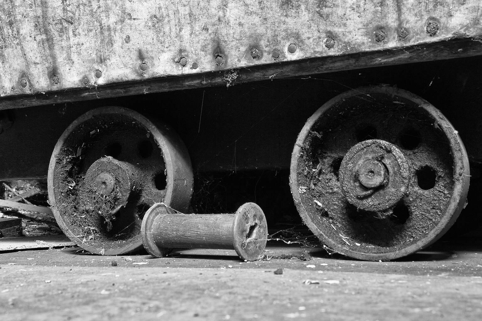 Rebecca Skinner Still-Life Photograph - "Wheels", black and white, abandoned, silk mill, industrial, vintage, photograph