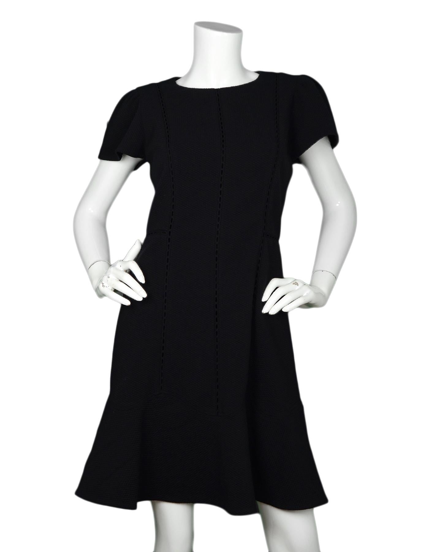 Rebecca Taylor NWT Black Shortsleeve Dress W/ Eyelet Detail Sz 8

Made In:  China
Color: Black
Materials: 94% polyester, 6% elastane 
Lining: 100% polyester
Opening/Closure: Hidden back zipper and hook eye 
Overall Condition: New with tags
Estimated