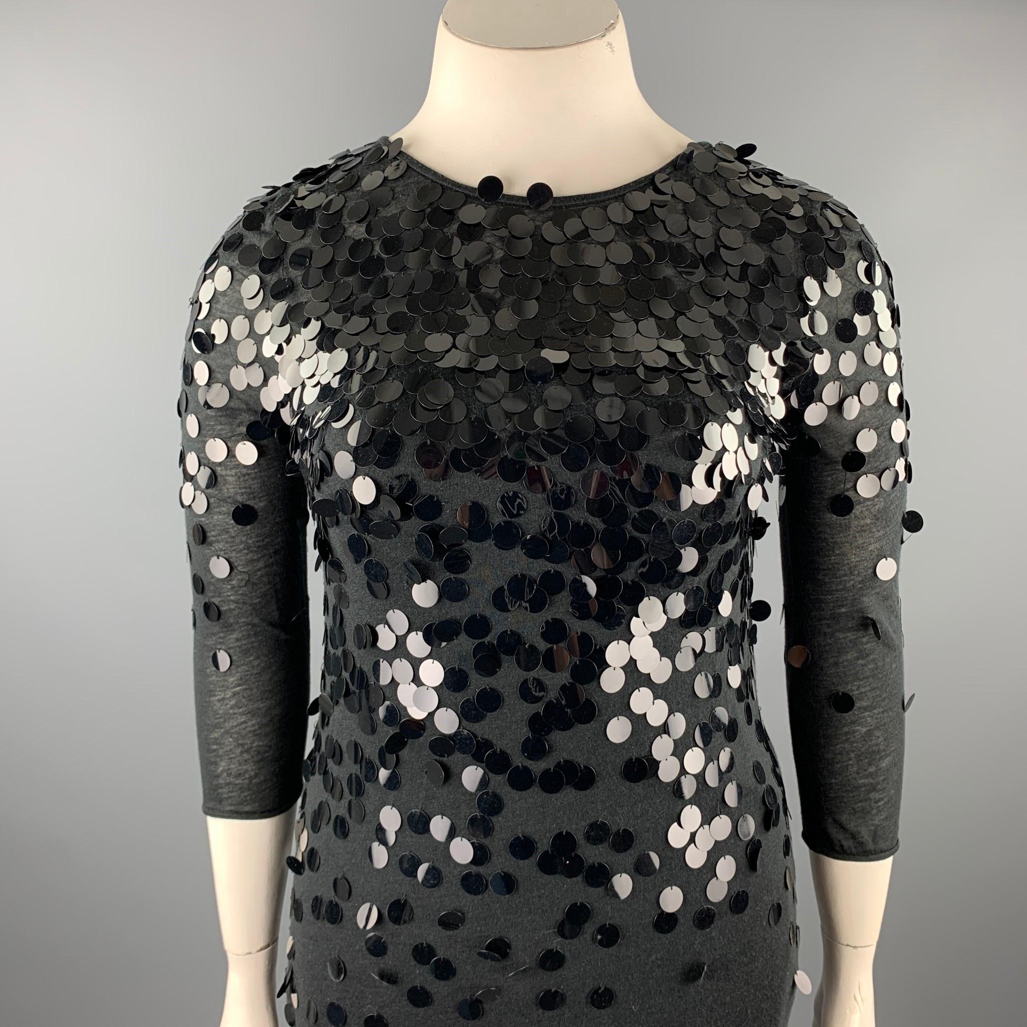 REBECCA TAYLOR dress comes in a black tencel blend with payette sequin details featuring a slip liner, 3/4 sleeves, and a back button closure. 

Good Pre-Owned Condition.
Marked: 10

Measurements:

Shoulder: 16 in. 
Bust: 33 in. 
Waist: 34 in. 
Hip: