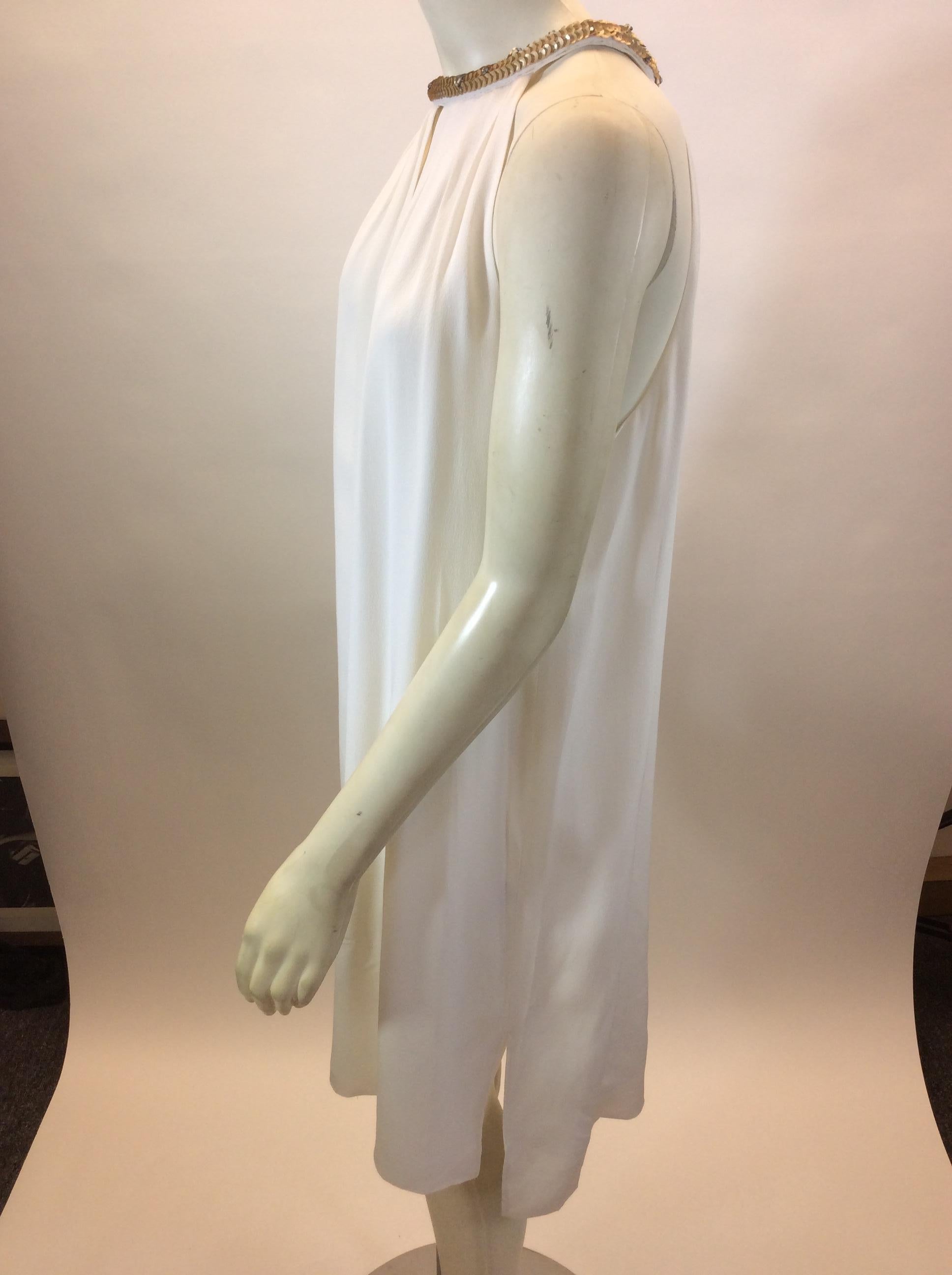 Rebecca Taylor White Dress with Gold Beaded Trim NWT
$265
Made in China
100% Silk
Size 10
Length 36