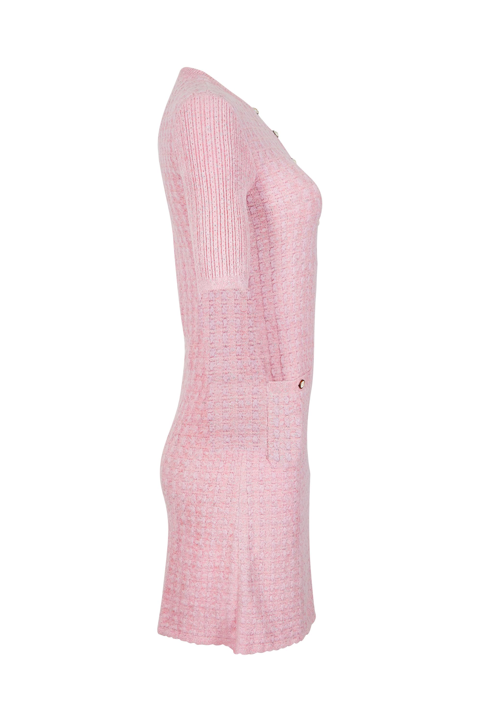 This desirable pale pink and silver knitted dress is a modern classic from Chanel and is chic, versatile and in beautiful condition. Comprised of soft mohair blend yarn subtly interspersed with silver lamé thread, it is woven to emulate the