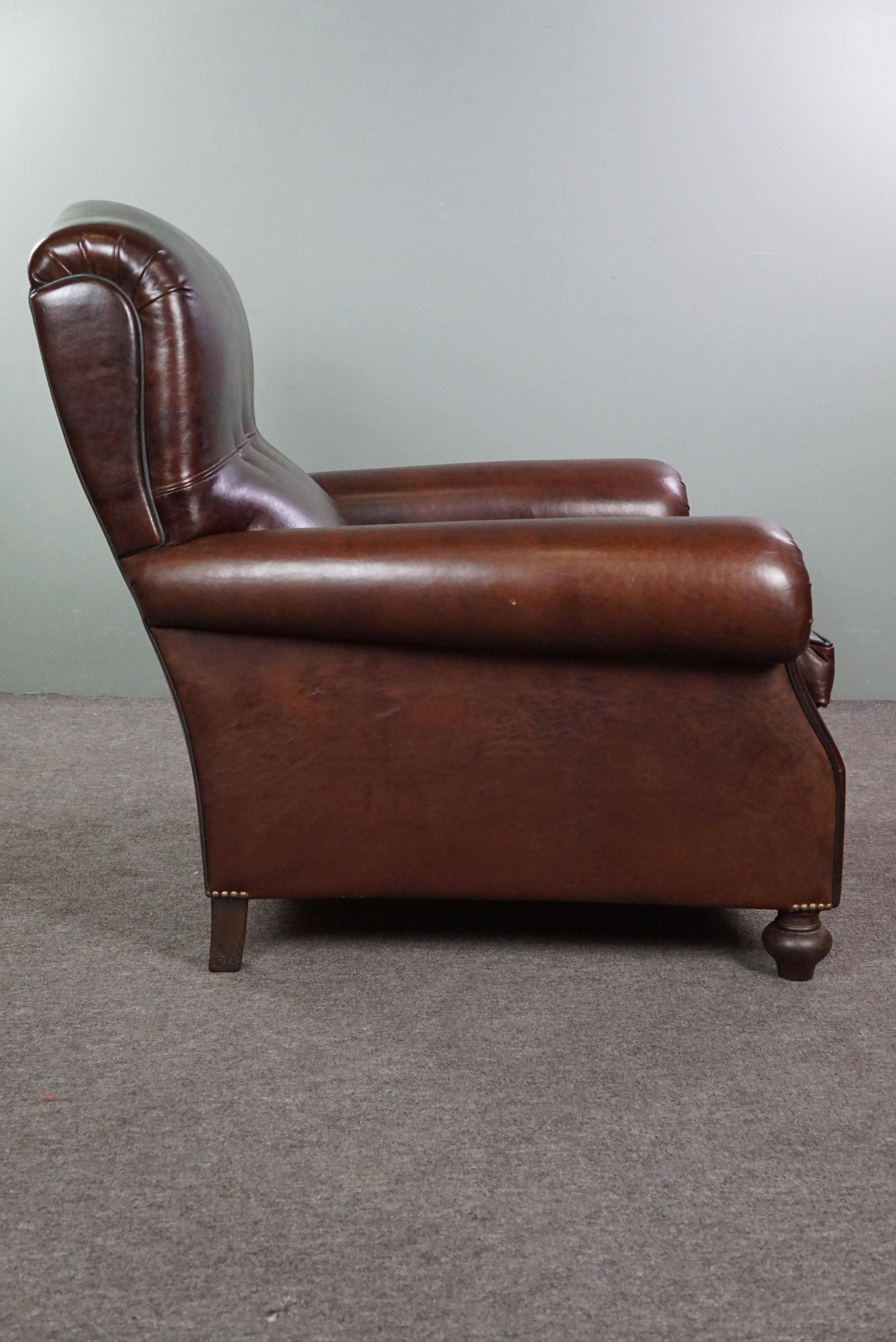 Recently reupholstered old English armchair in dark sheep leather color In Good Condition For Sale In Harderwijk, NL