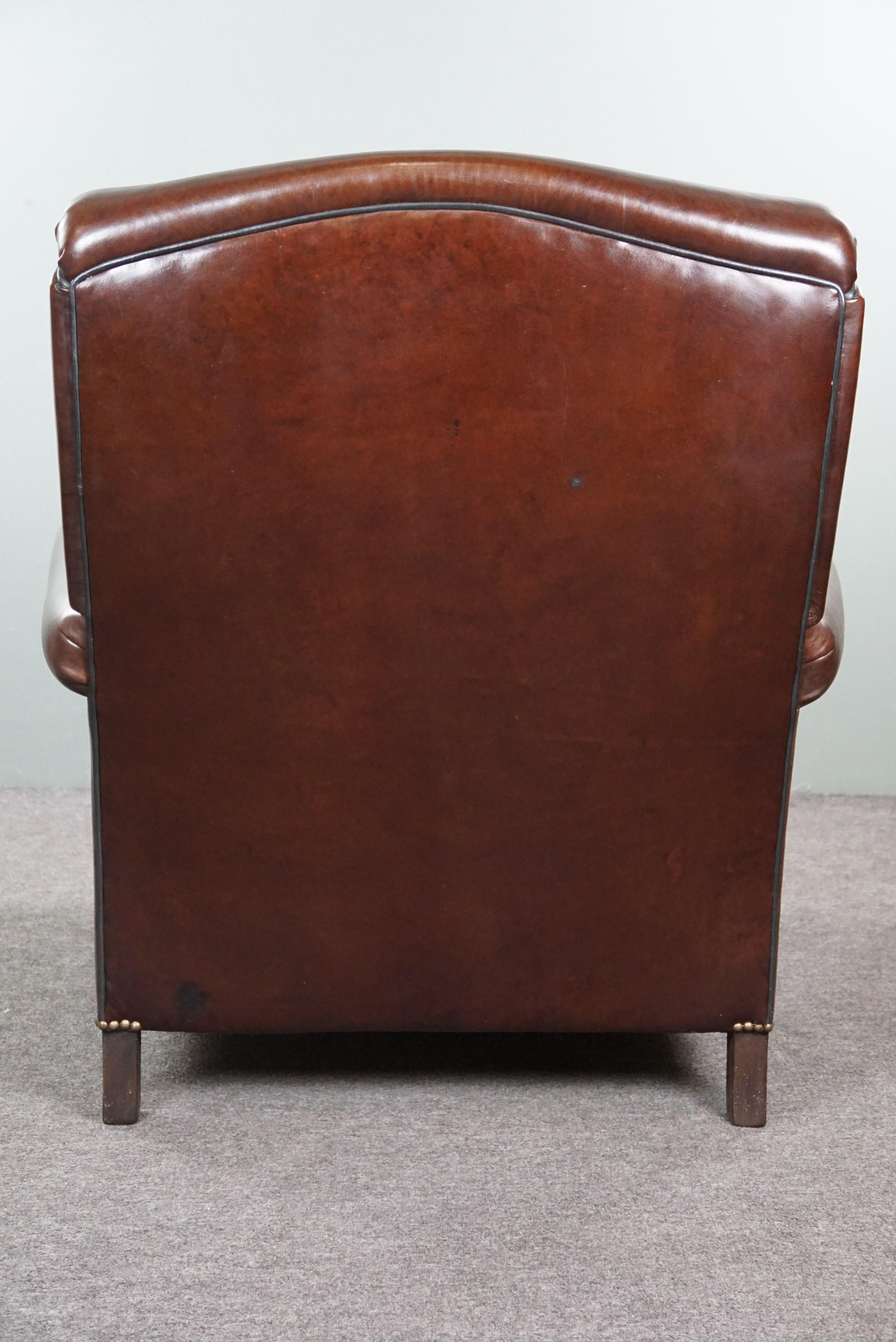 Mid-20th Century Recently reupholstered old English armchair in dark sheep leather color For Sale