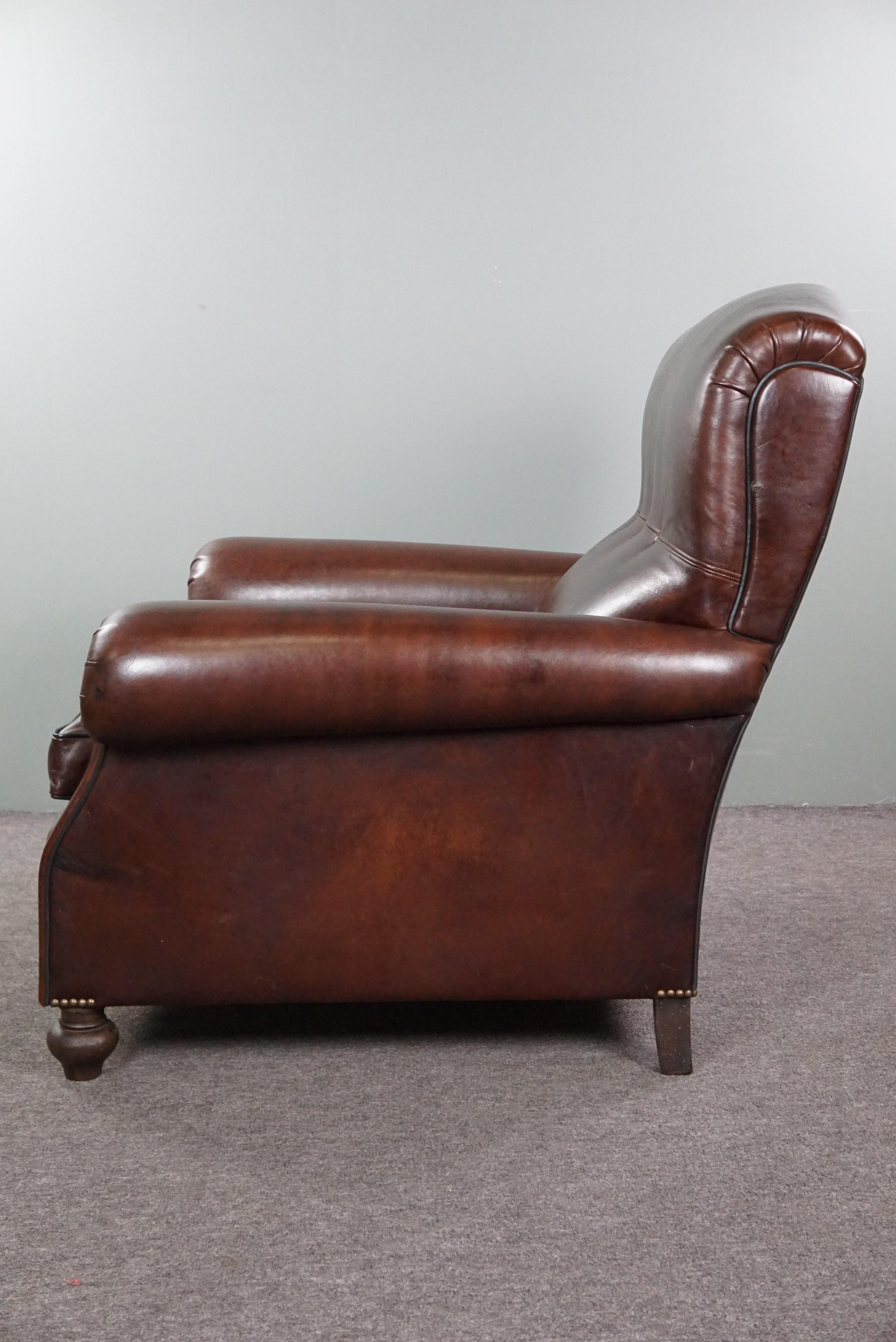Leather Recently reupholstered old English armchair in dark sheep leather color For Sale