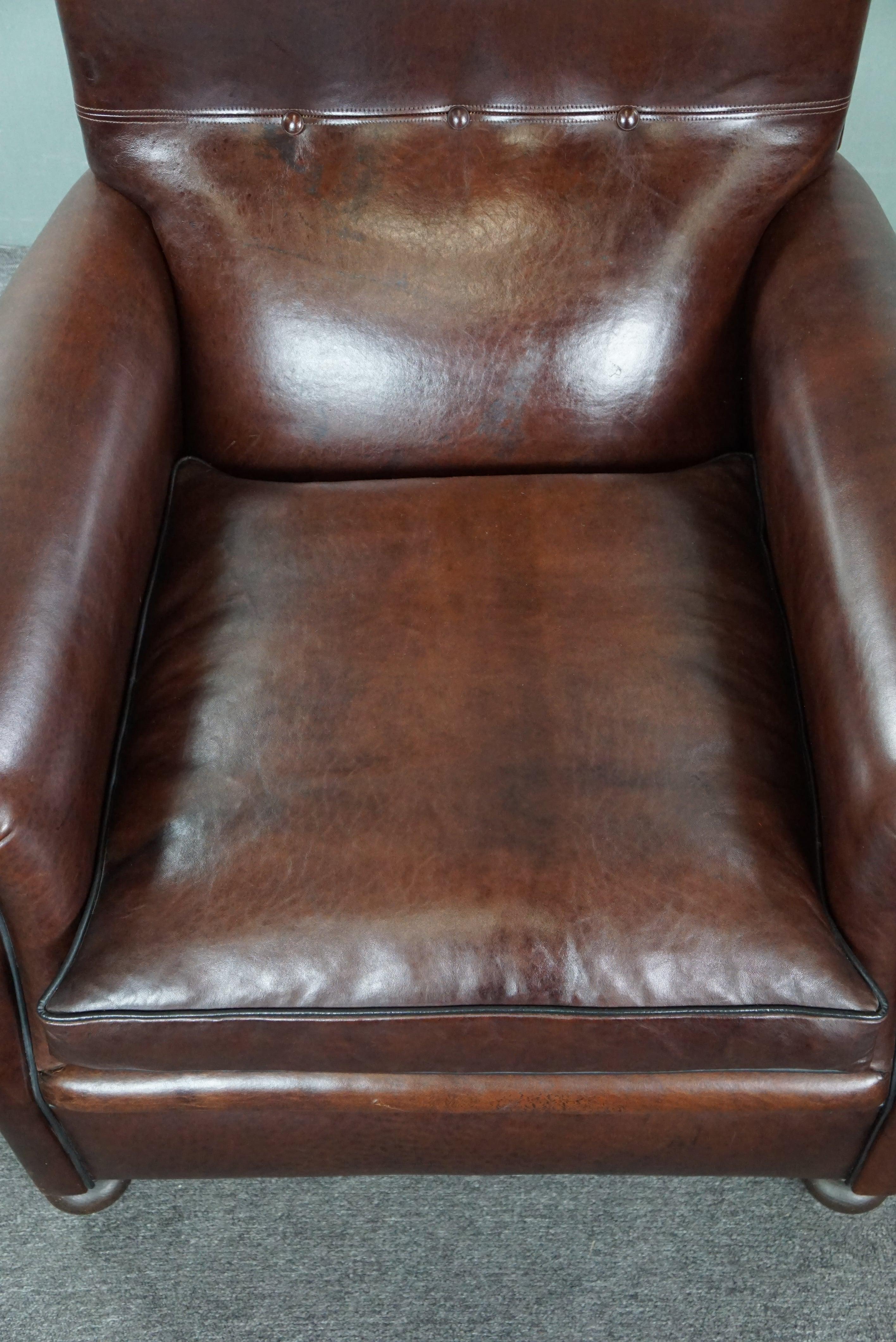 Recently reupholstered old English armchair in dark sheep leather color For Sale 1