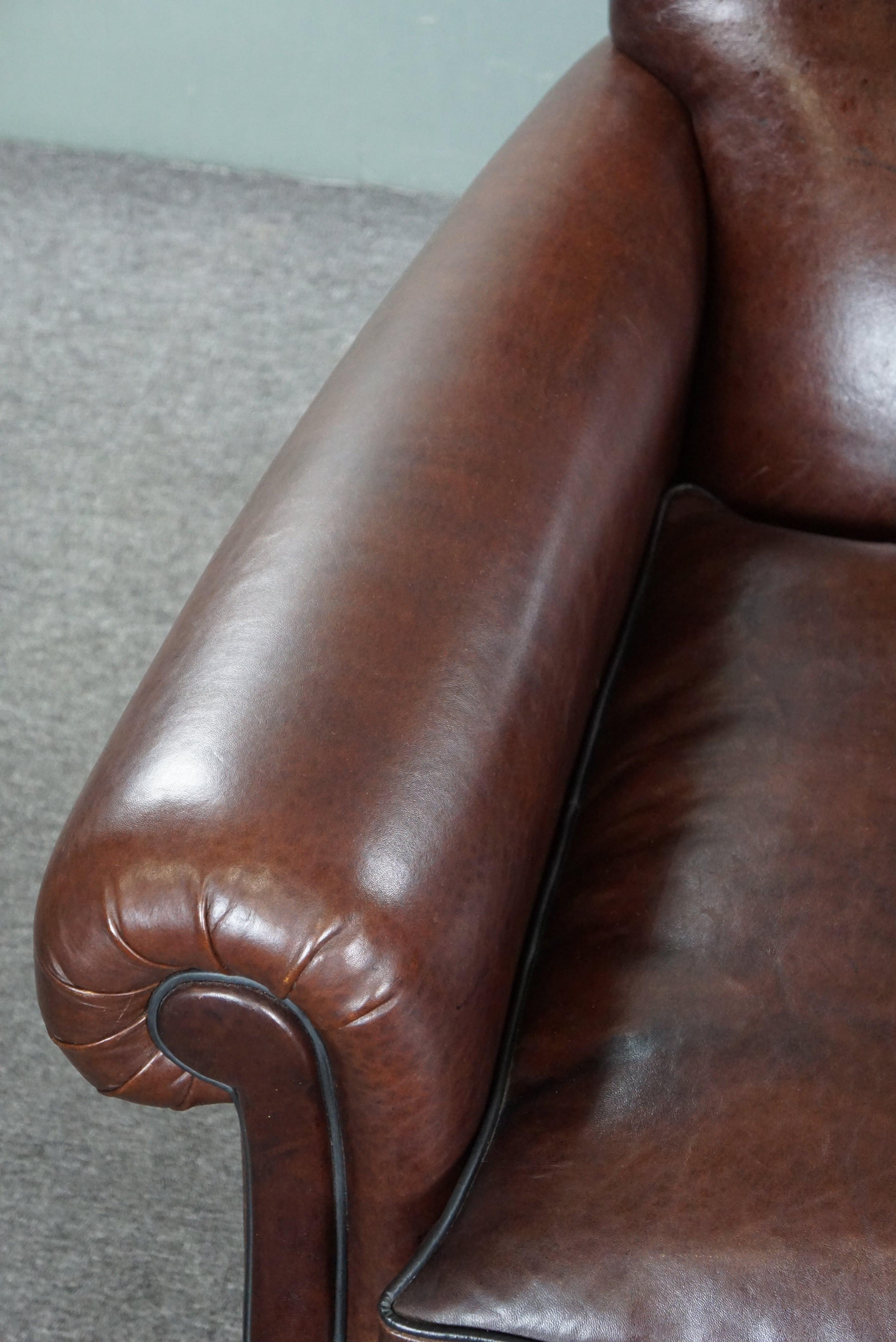 Recently reupholstered old English armchair in dark sheep leather color For Sale 2