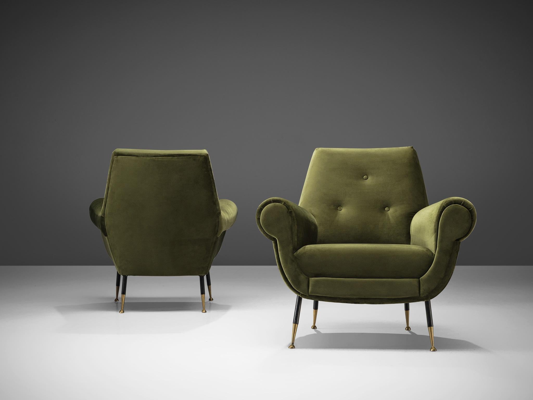 Easy chairs, green velvet, metal, brass, Italy, 1950s

These comfortable easy chairs have thick armrests and are full and rounded. The top is flat and the sides are curved and thick, featuring Classic, traditional details. For instance the