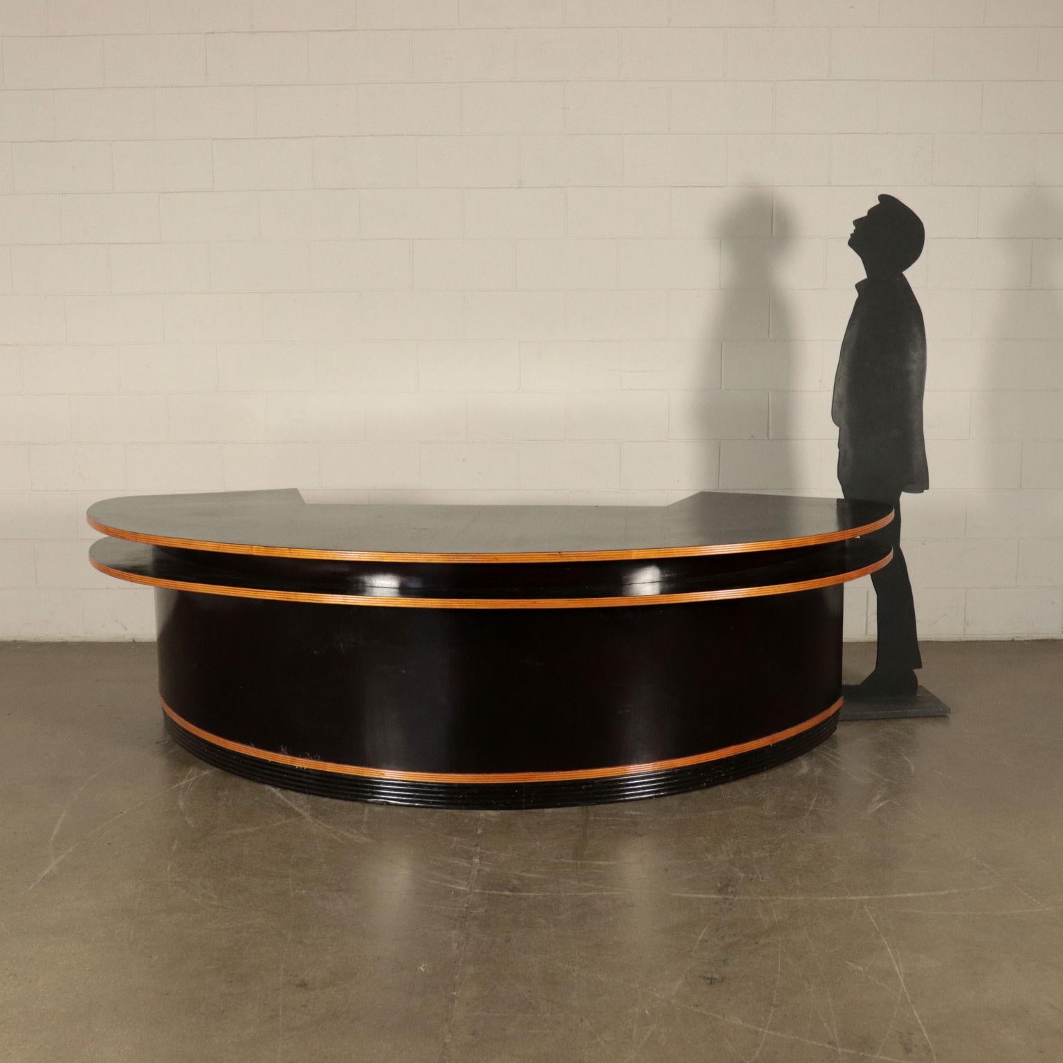 Big reception desk with compartments and internal chests of drawers; veneered and ebony stained wood, solid wood edgings.