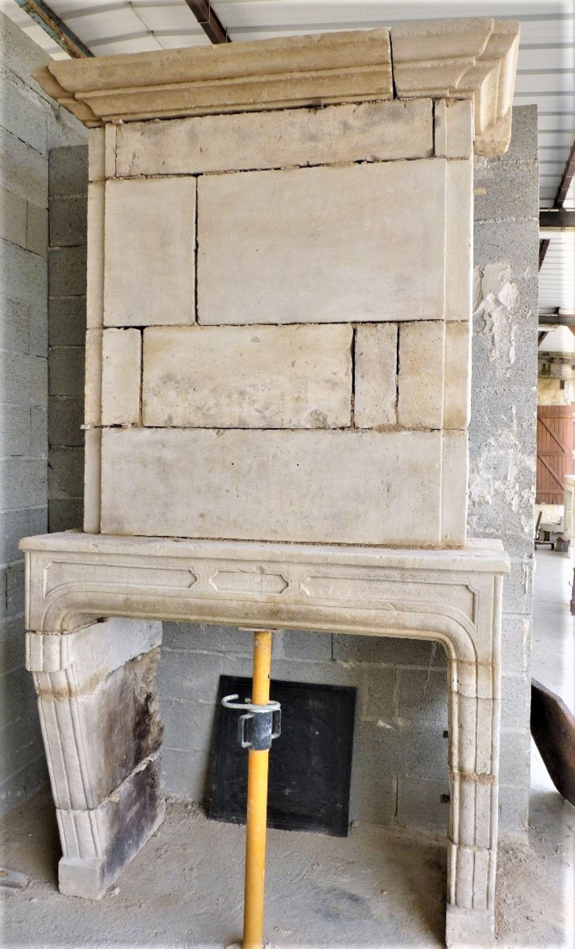Reclaimed antique carved Stone Fireplace Mantle chimney surround Los Angeles CA . Rare 18th century Louis XIV carved stone fireplace from Provence. Under Louis XIV, everything is full of richness and luxury, everything is grandiose and monumental.