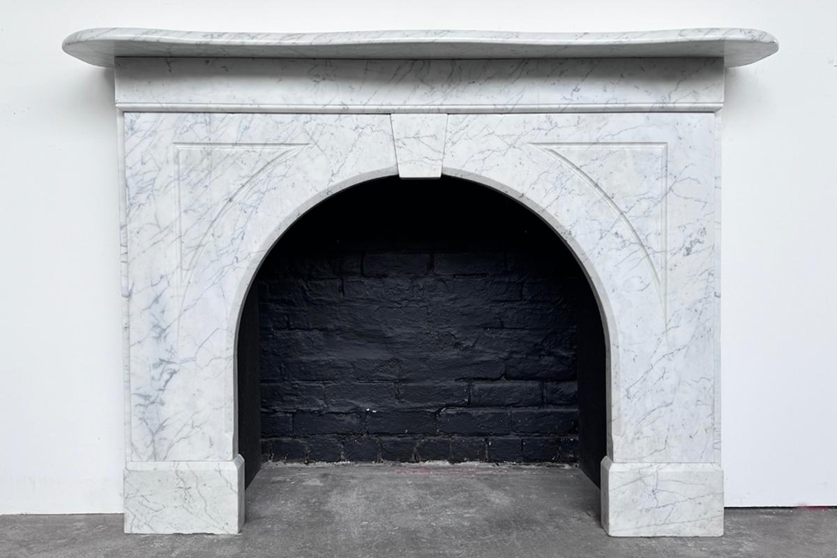 arched marble fireplace surround