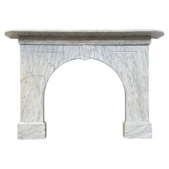 Reclaimed arched Victorian Carrara marble fireplace surround