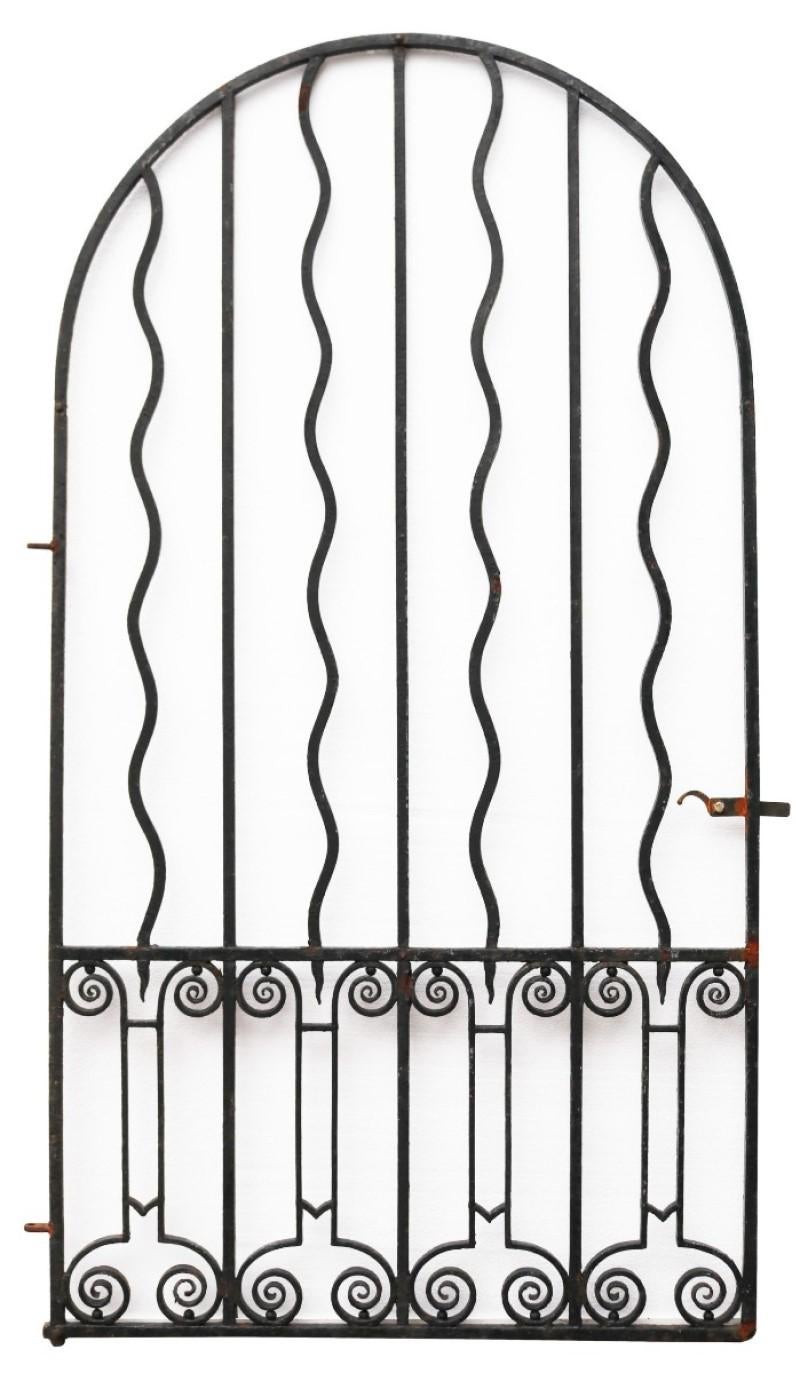 A wide antique gate with arched top. Constructed from wrought iron.

Additional Dimensions:

For an opening of approximately 132 cm.