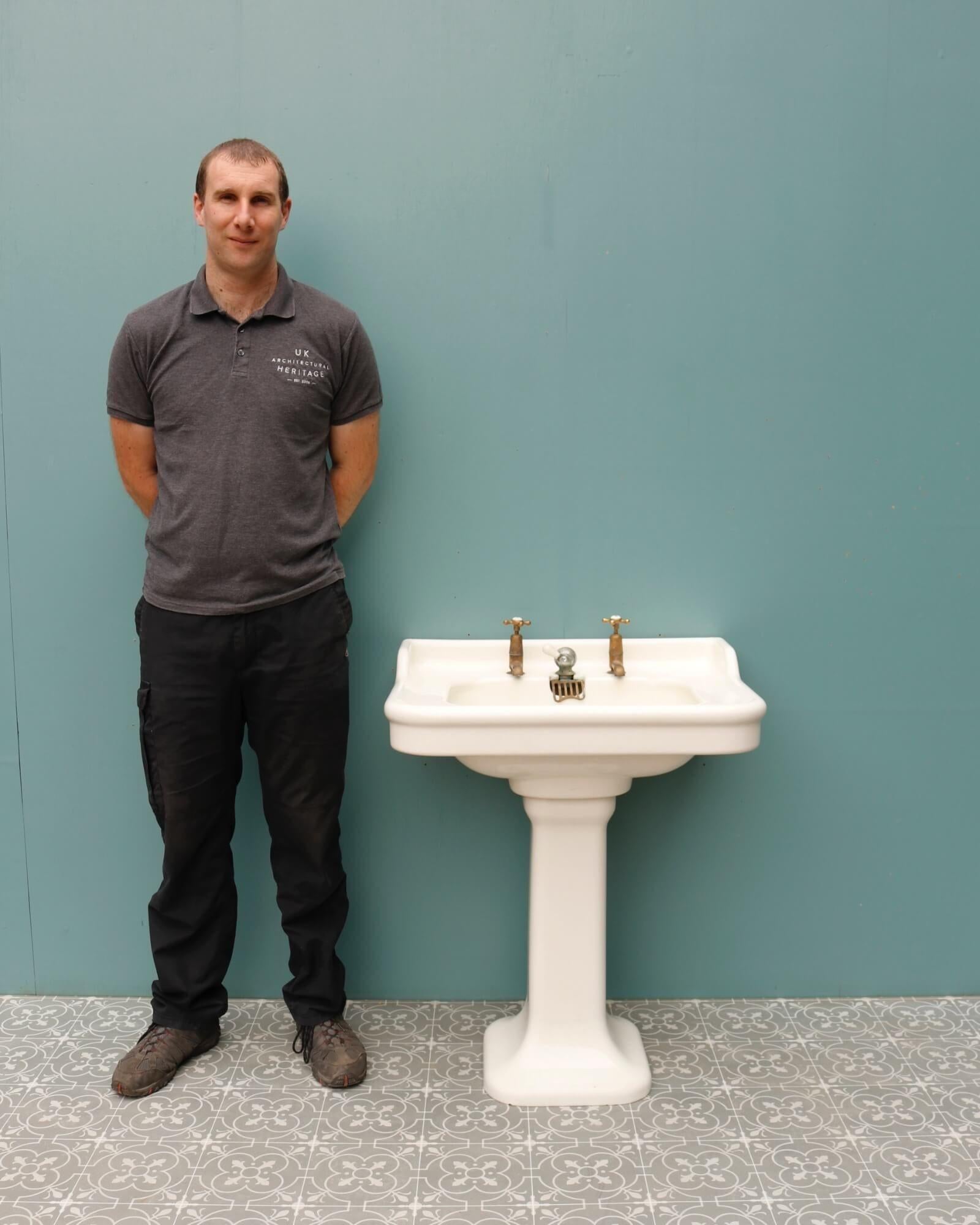 A reclaimed Art Deco Porcher pedestal sink dating from circa 1920. This simple yet elegant antique sink has a sophisticated French style that would give a bathroom in either a contemporary or period home a smart and elegant look. It features a