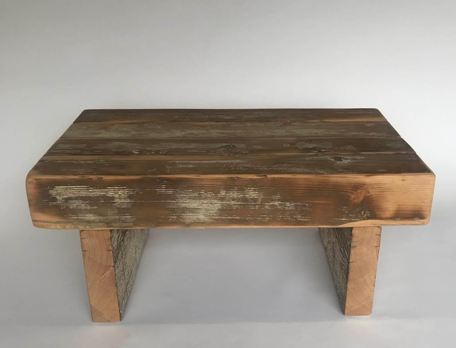 Small table or bench made from reclaimed wood beams. Some traces of old white paint remains. Great little rustic side table, coffee table or bench.