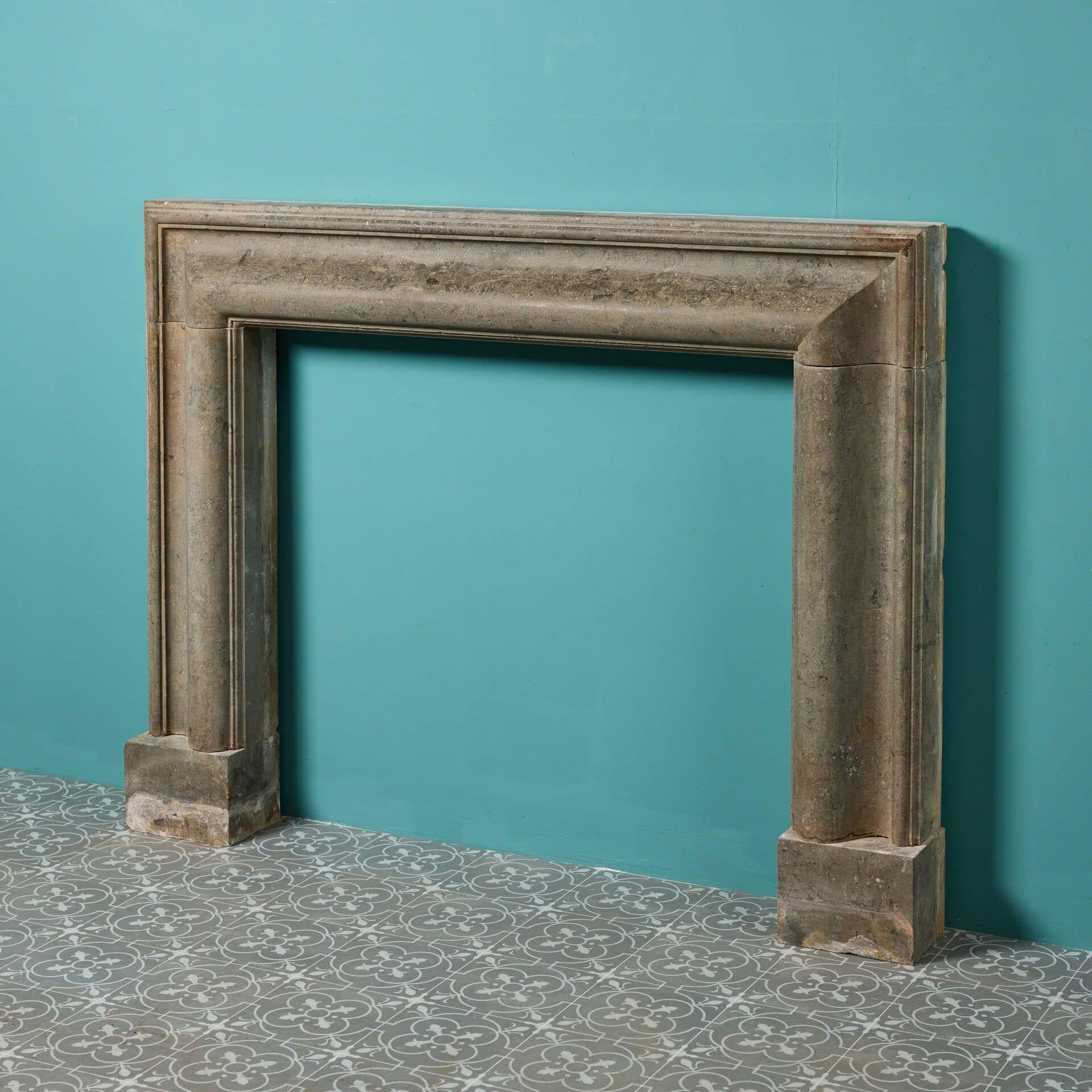 An English reclaimed limestone fire mantel in bolection style dating from the early 20th century. Though over 120 years old, this bolection fireplace looks stunning in both period and modern settings thanks to its simple lines and neutral colour.