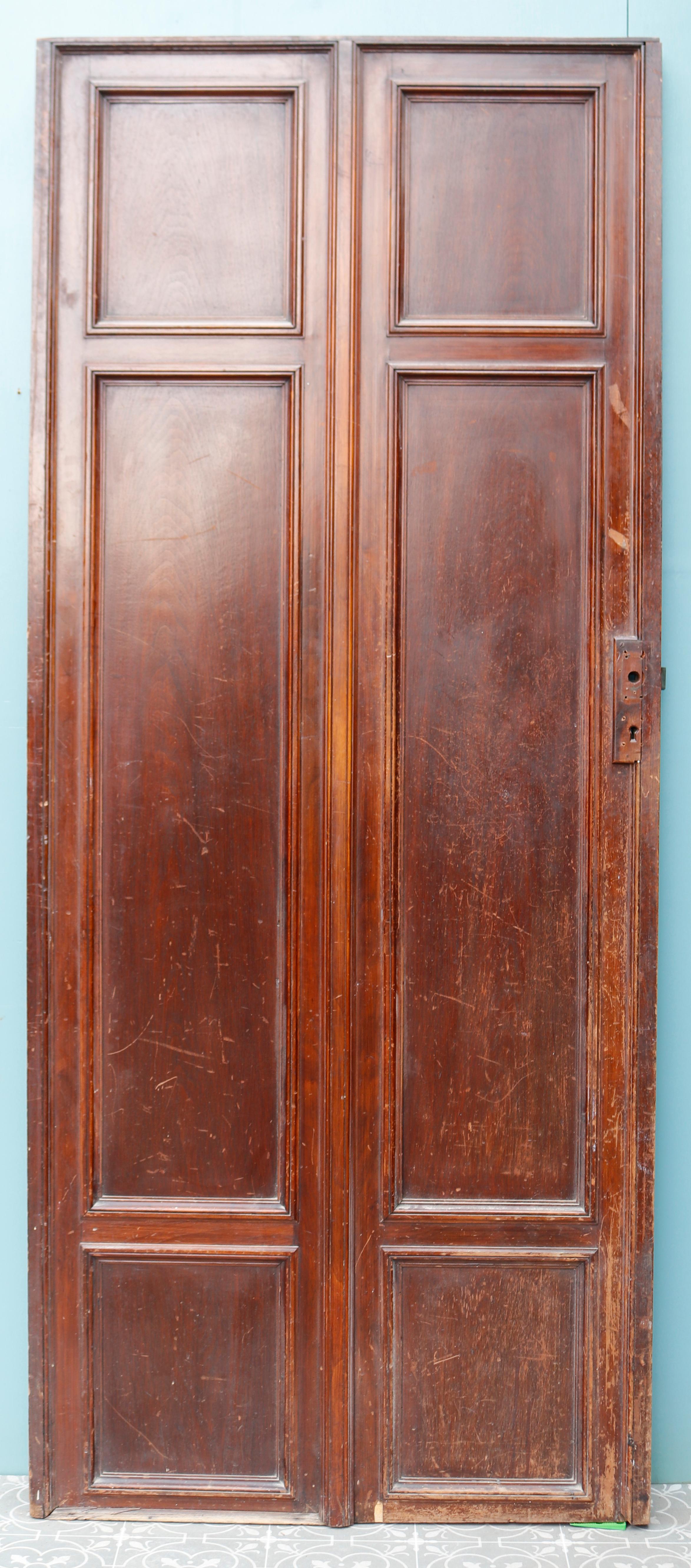 Reclaimed carved walnut door. Antique carved walnut door. This French, early 20th century door includes carved leaf patterns in a grand design on all six panels. A very decorative interior door in Louis XVI style. If you need help choosing your
