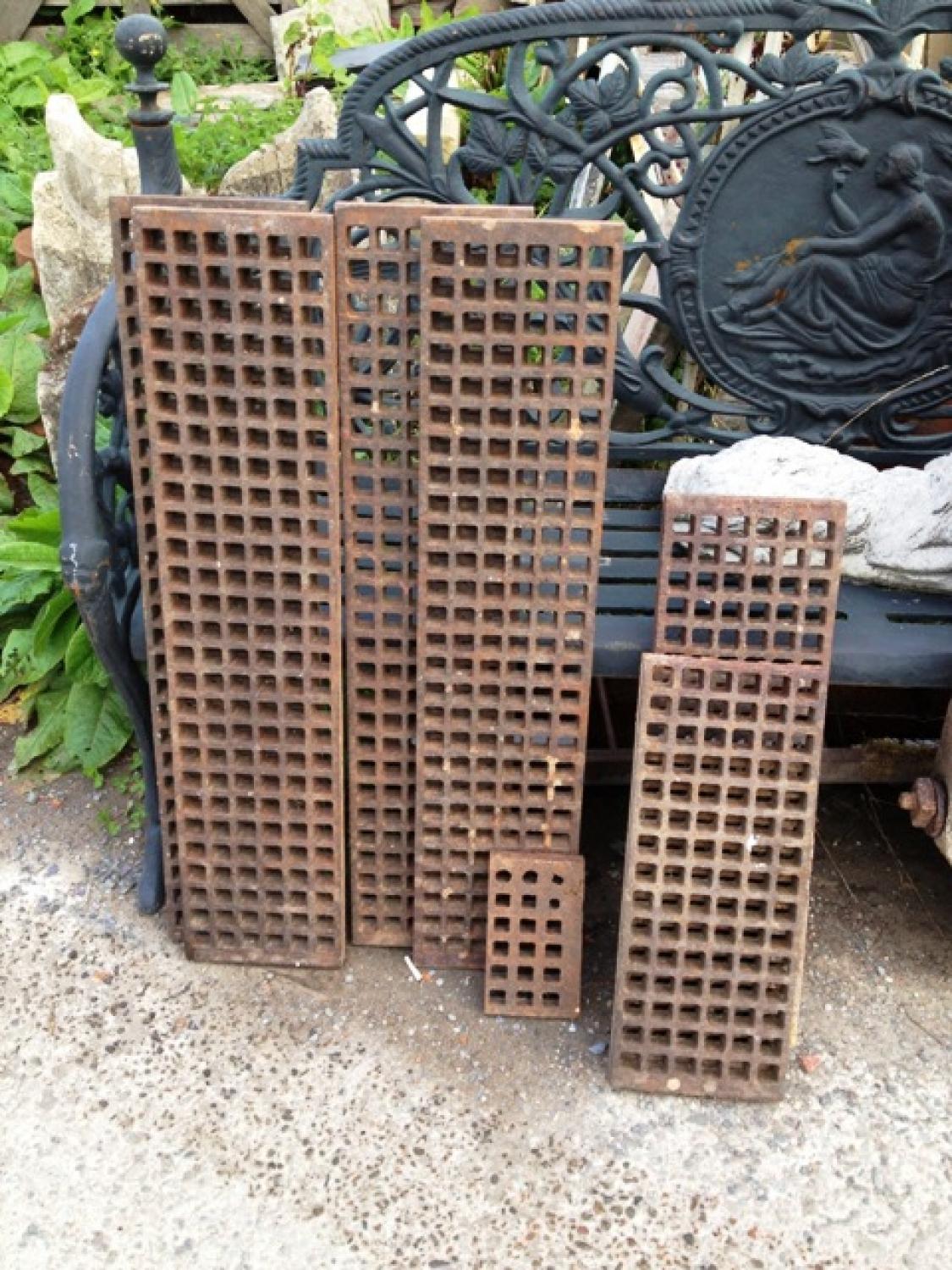 Cast iron grating, probably from a greenhouse, to cover heating pipes. This type of grating also found in churches, again to cover heating pipes and allow passage of hot air. One piece remaining: 20.3cm wide x 63.5cm high x 25mm thick - small piece