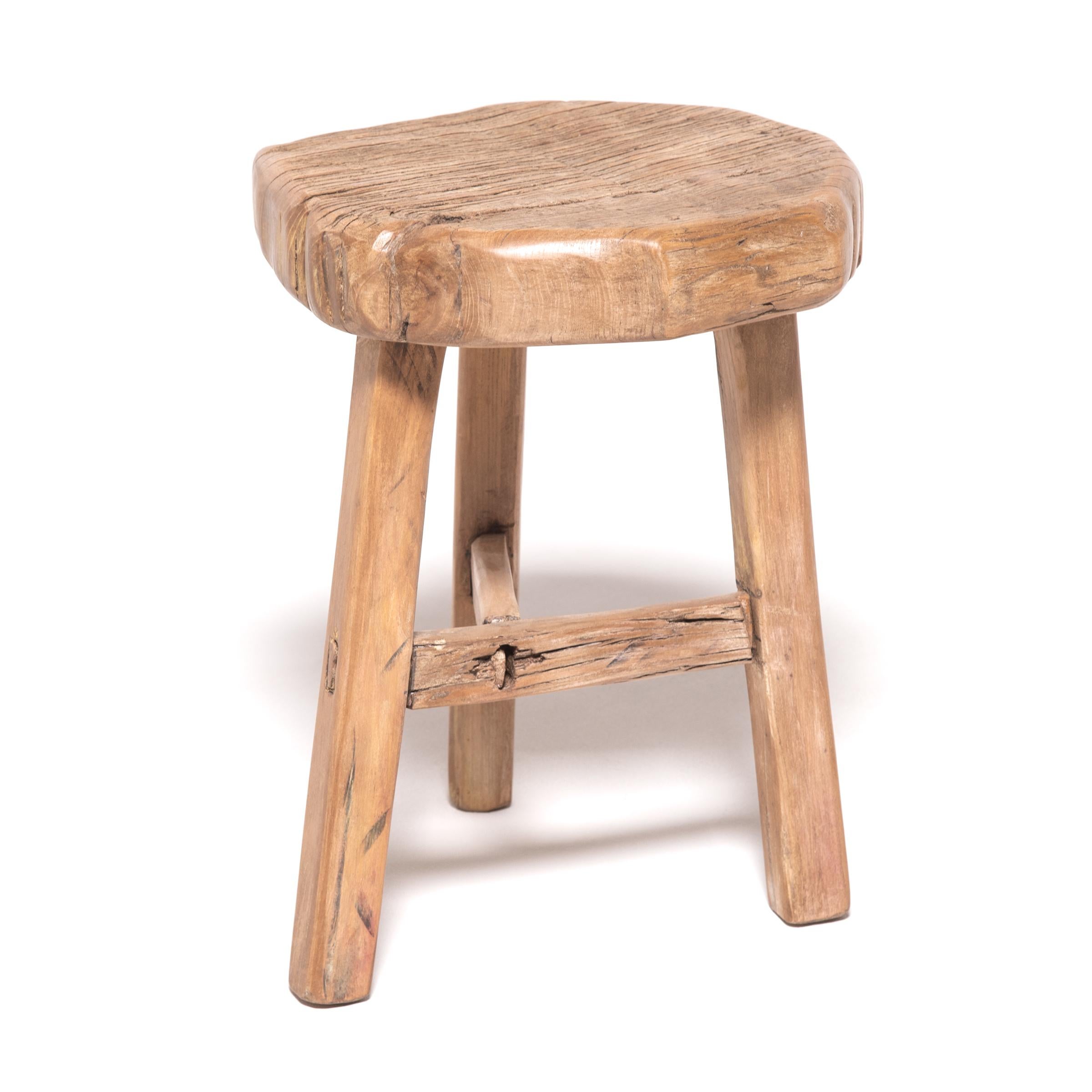 Made of wood reclaimed from 18th century Chinese buildings, this contemporary three-legged stool is the epitome of farmhouse modern. Skilled in traditional joinery techniques, our craftspeople fashioned a simple, portable stool, much like those that